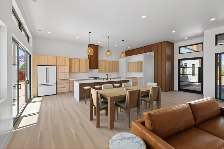 Dining space with light wood-style flooring and recessed lighting
