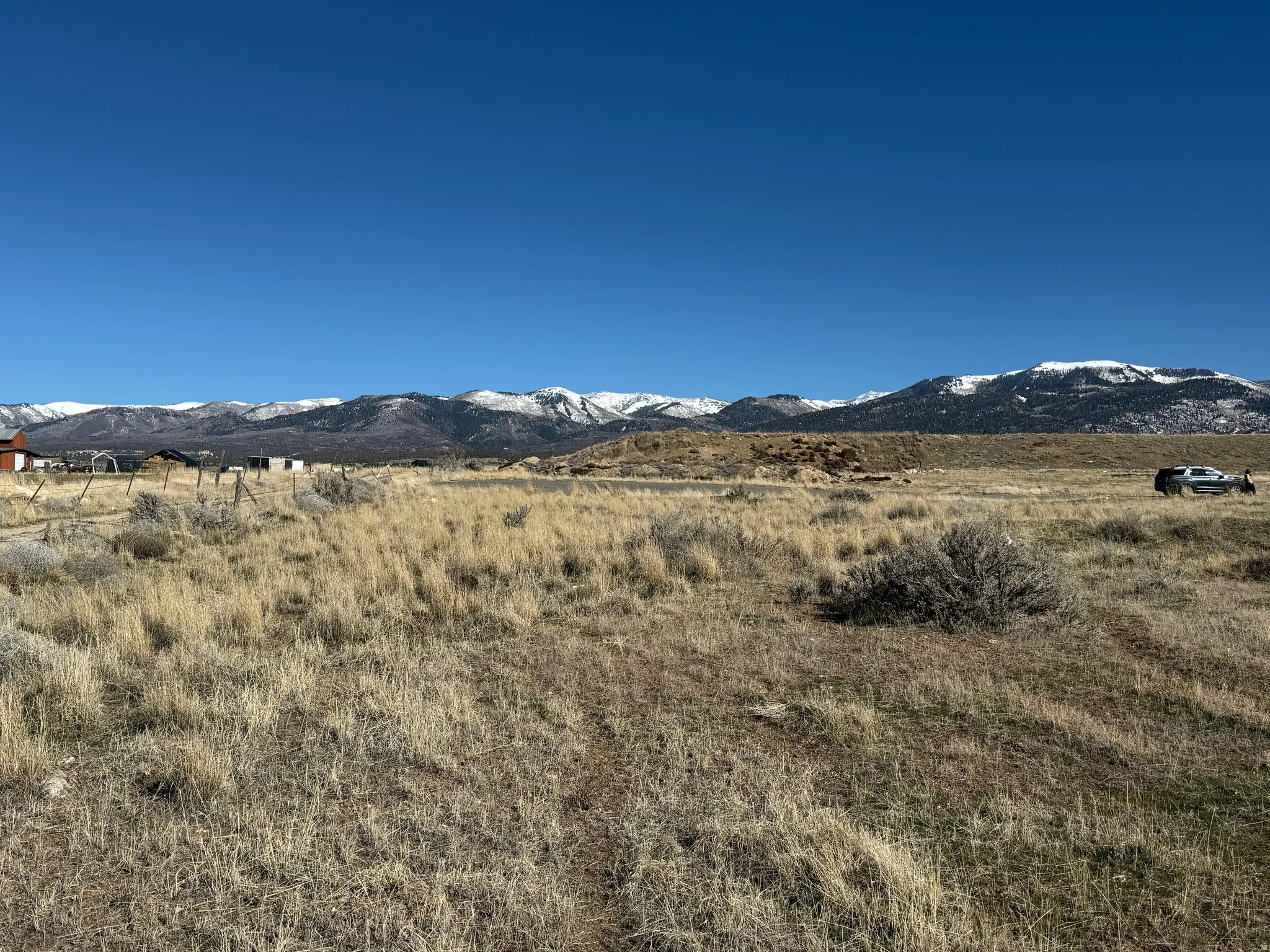 View of mountain backdrop featuring rural landscape