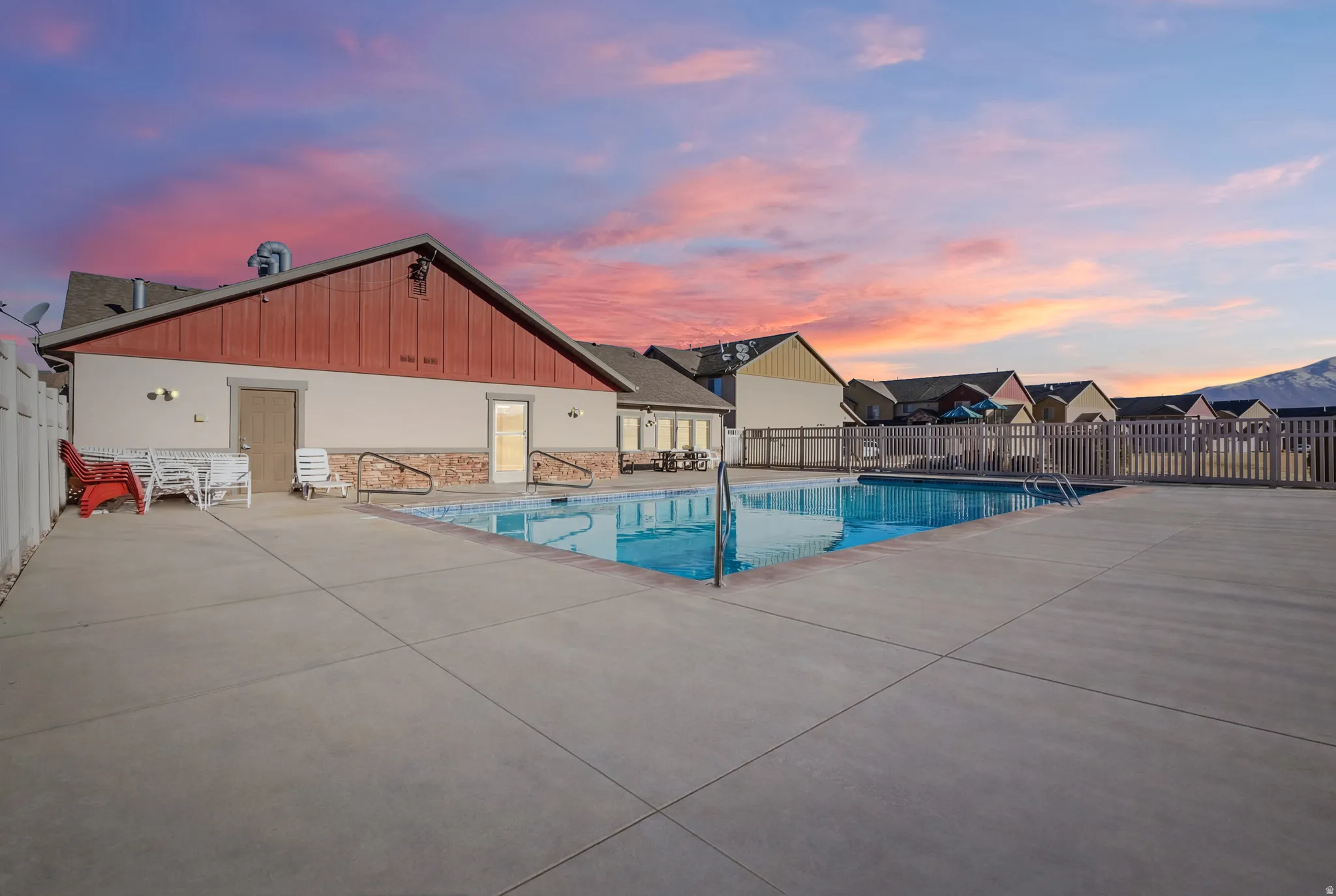 Community pool featuring a patio