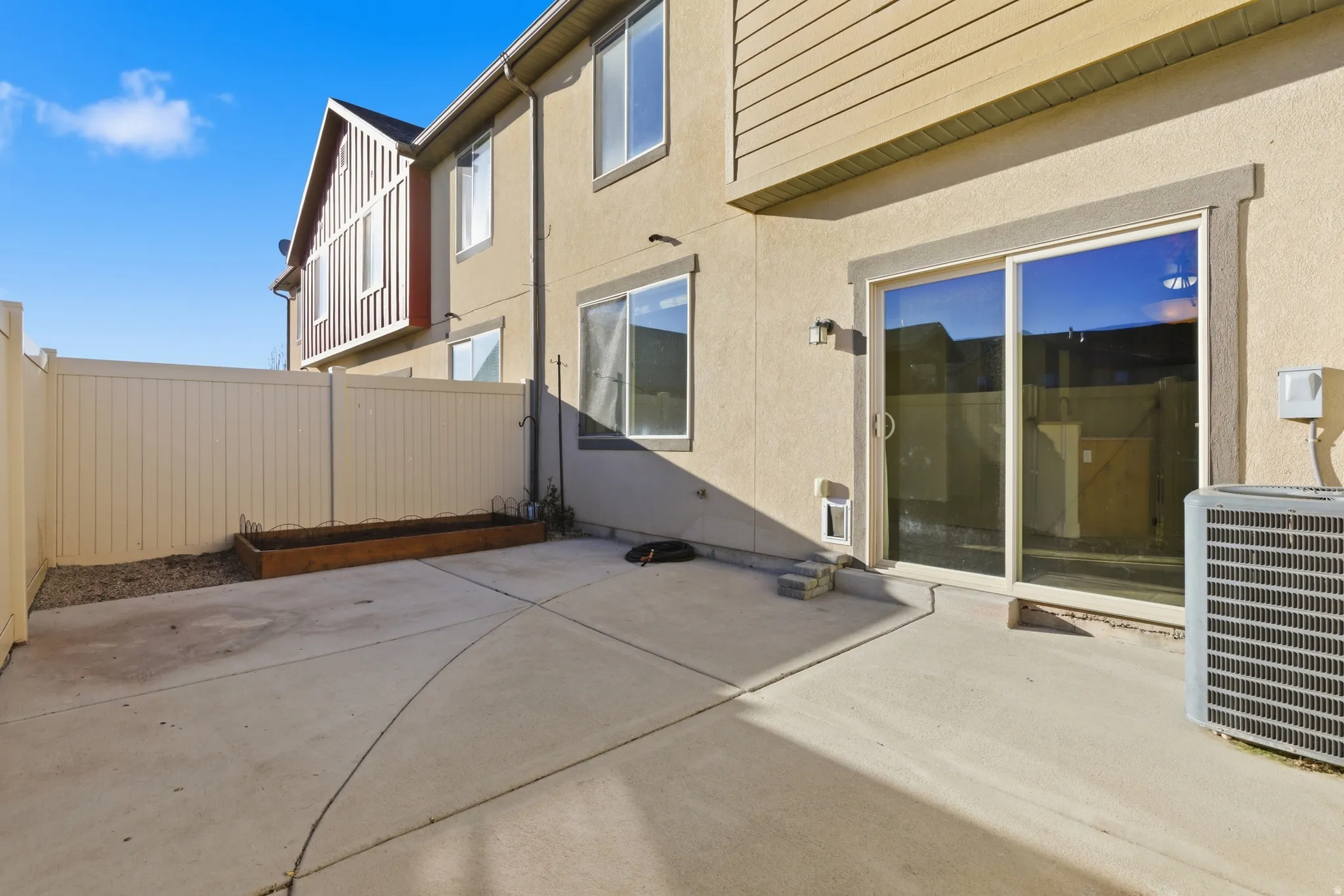 Fenced backyard featuring a patio area