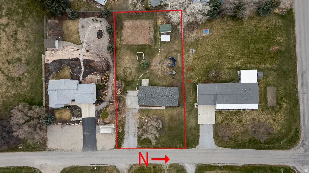 Aerial perspective of suburban area with property boundaries highlighted
