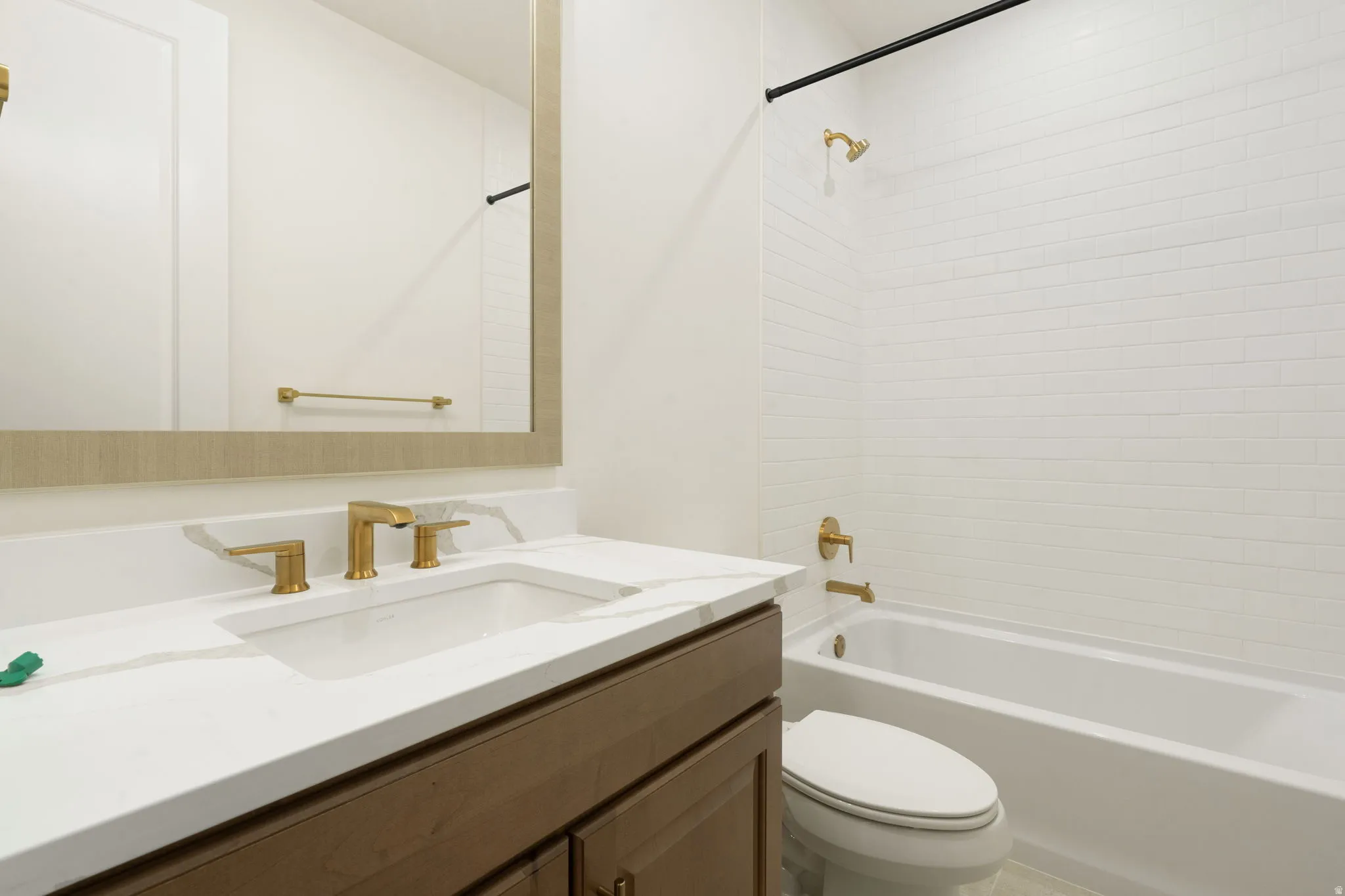 Bathroom featuring vanity and bathing tub / shower combination