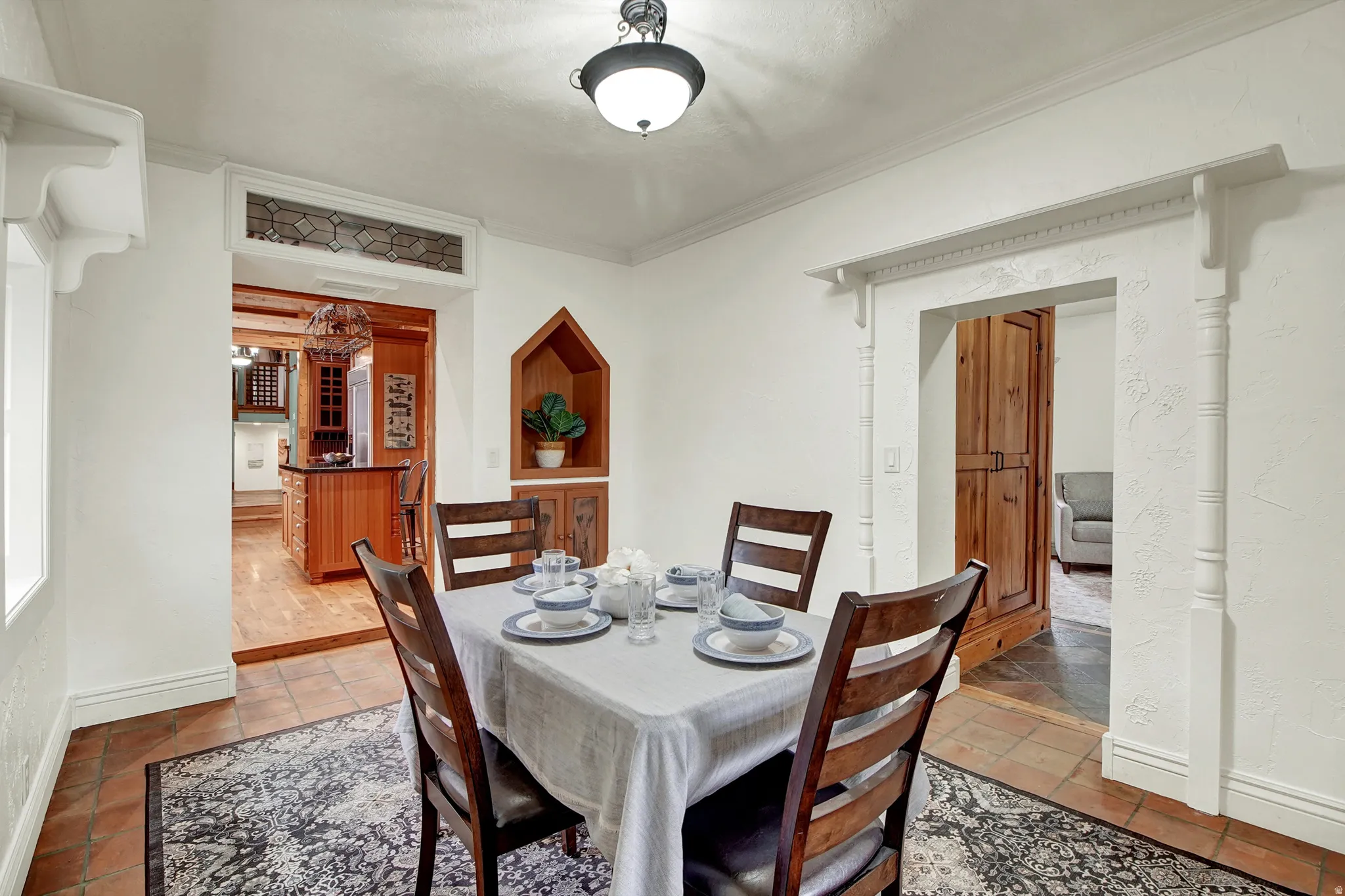 Dining area featuring ornamental molding and baseboards