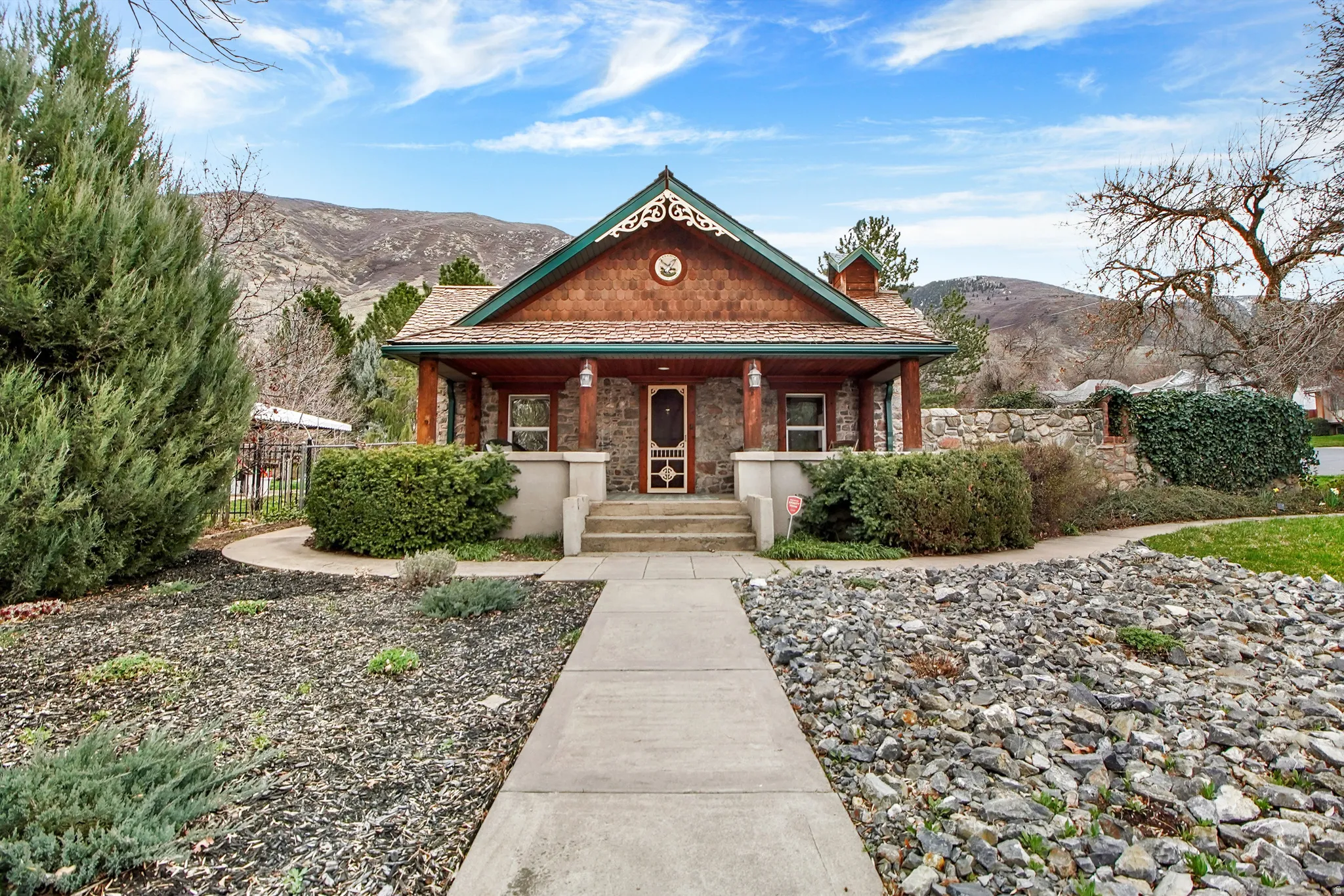 View of front of home with a porch and a mountain view