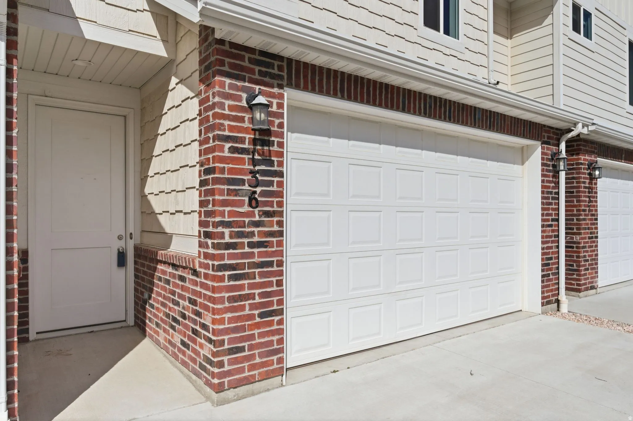 Garage featuring concrete driveway