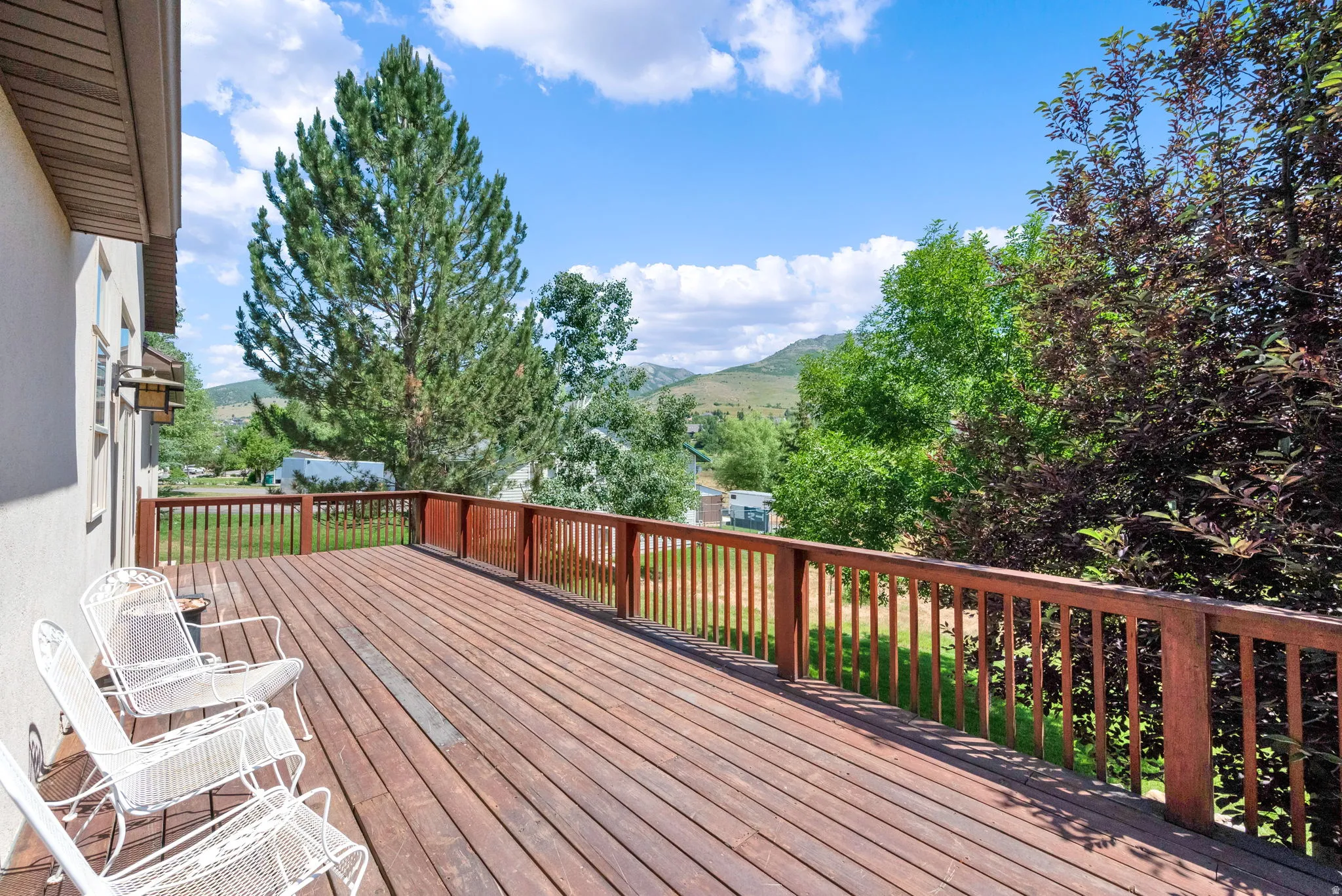 Wooden terrace featuring a mountain view