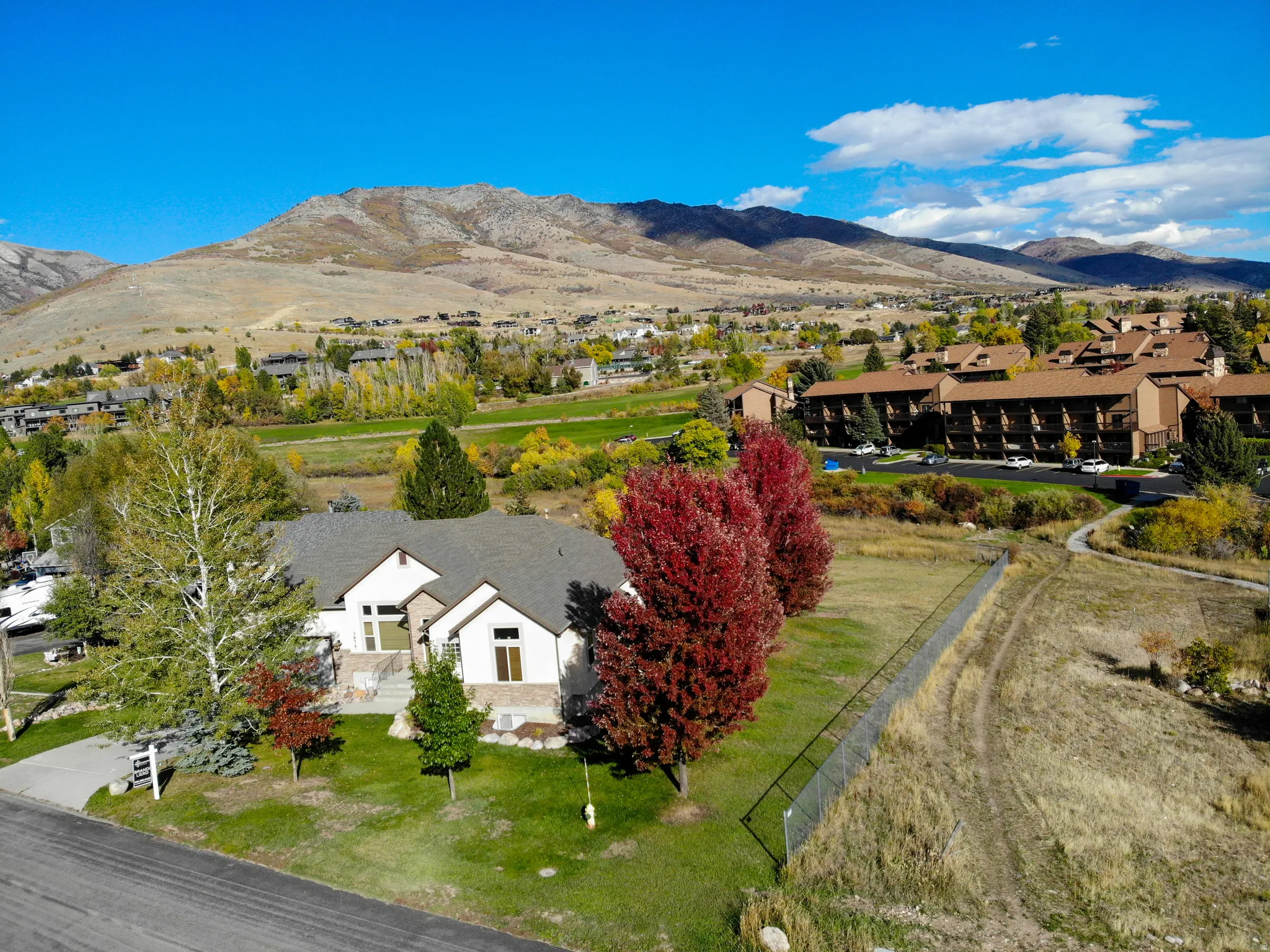 Bird's eye view of mountains and golf course.