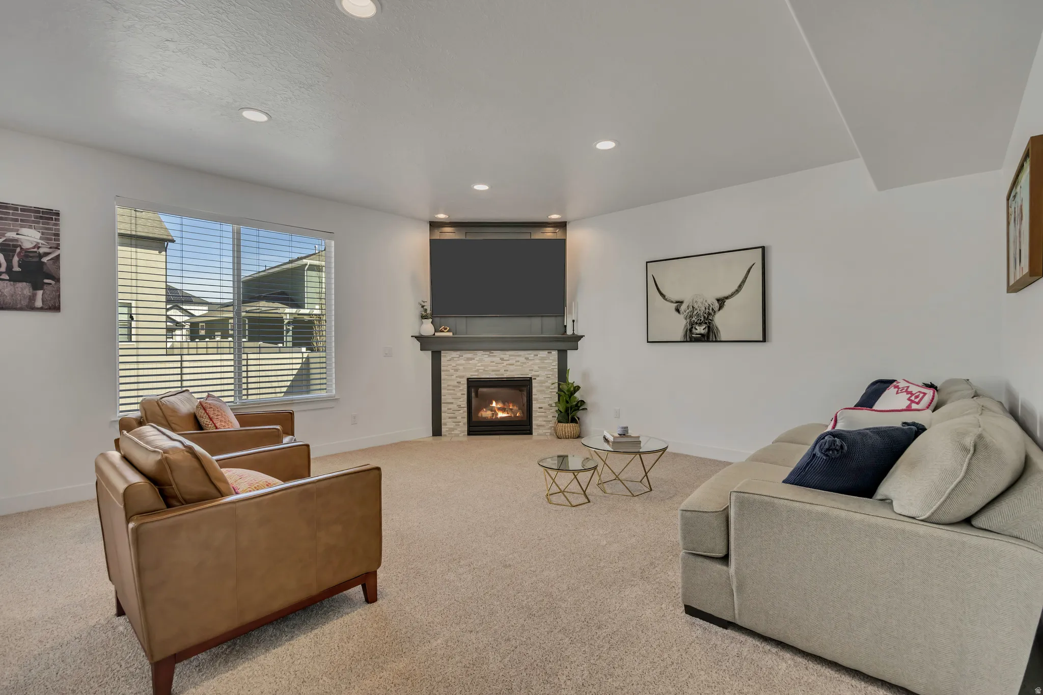 Living room featuring recessed lighting, carpet flooring, and a glass covered fireplace