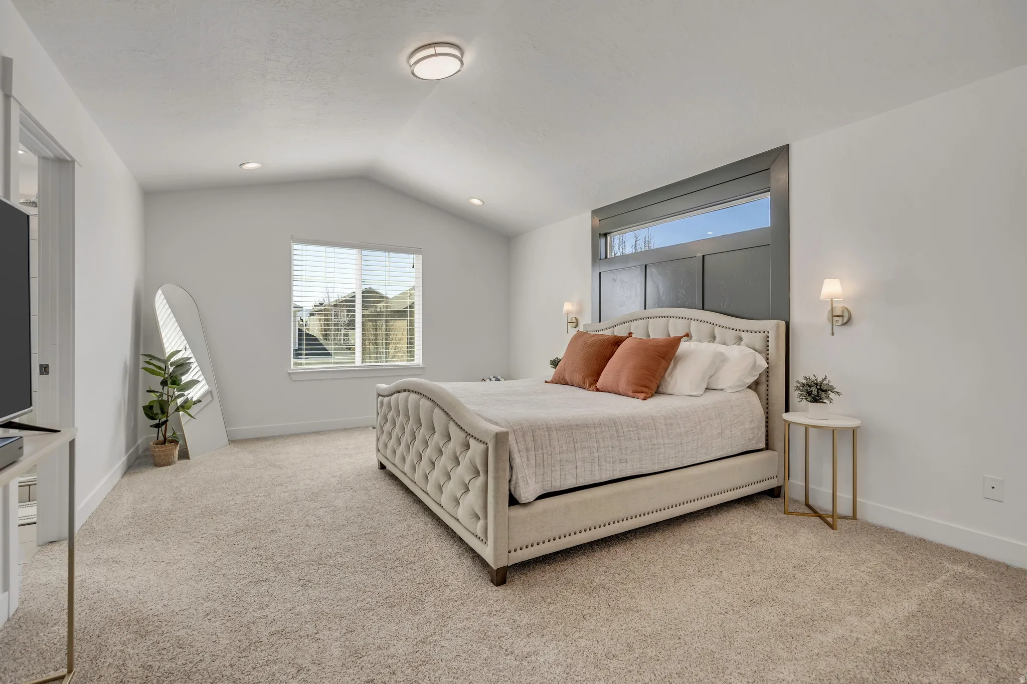 Bedroom with light carpet