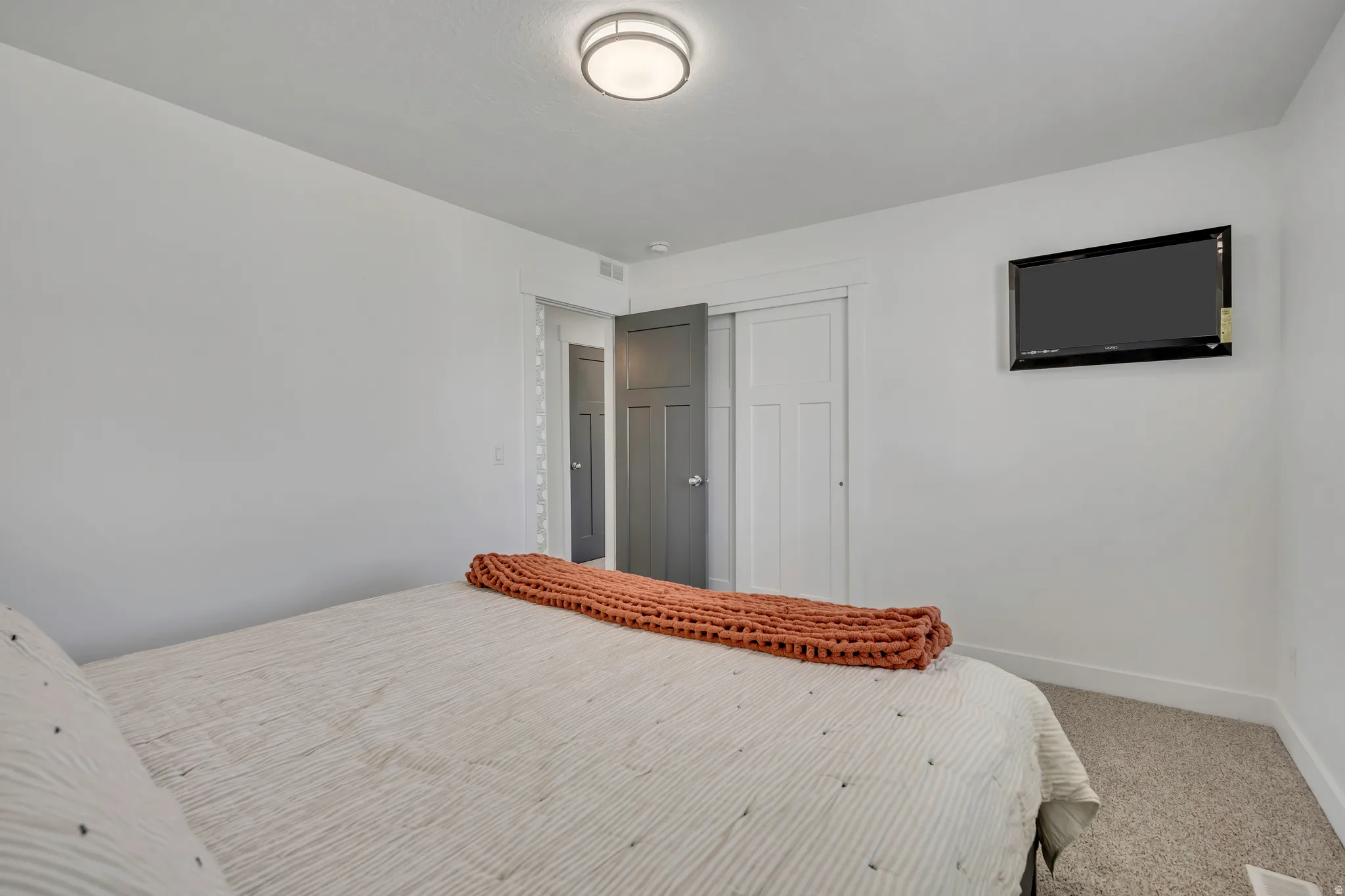 Bedroom with carpet floors and a closet
