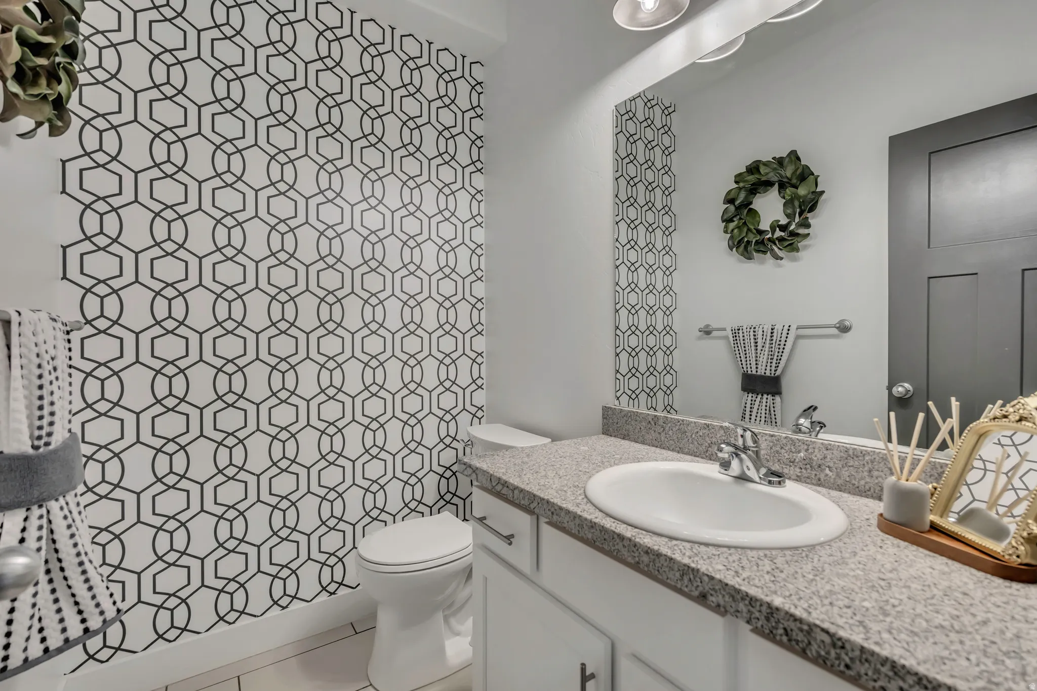Bathroom with vanity and light tile patterned flooring