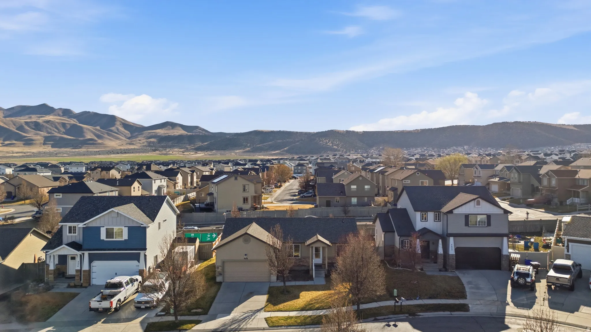 View of mountain background featuring nearby suburban area