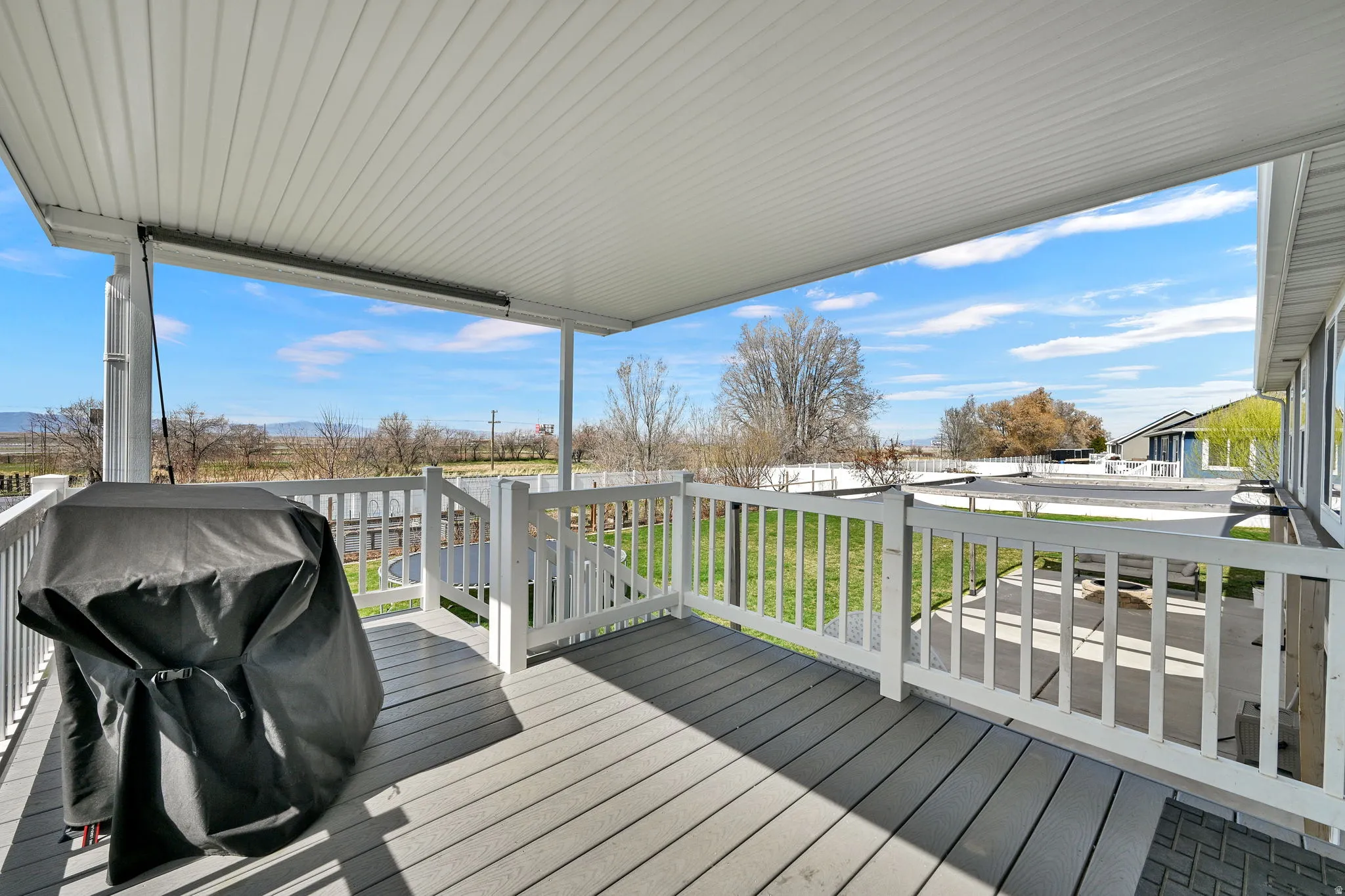 Deck with grilling area and a yard