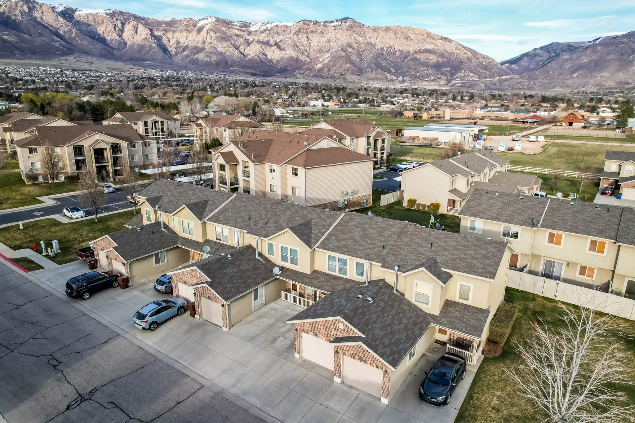 Aerial perspective of suburban area with a mountain backdrop