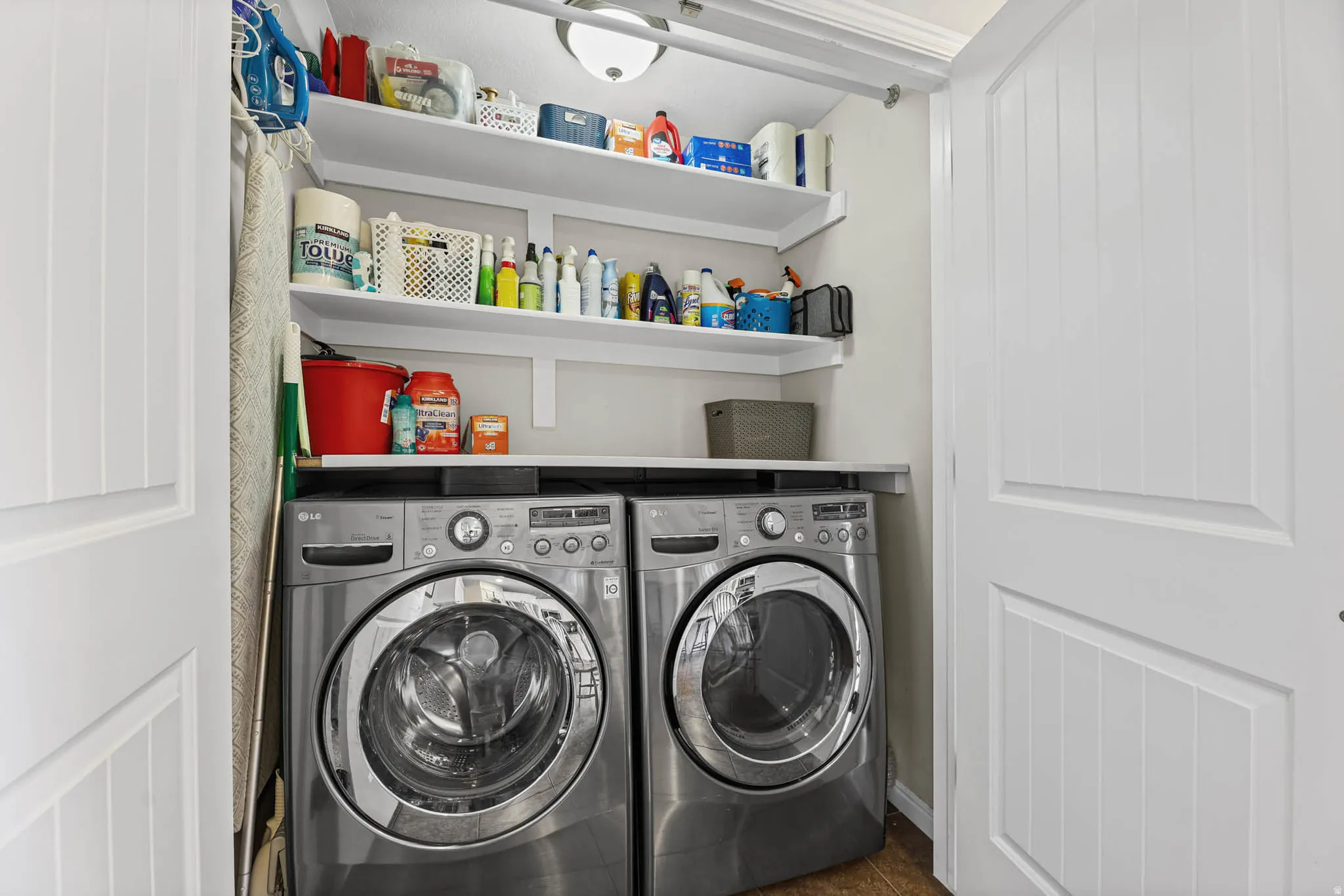 Laundry area featuring washing machine and clothes dryer