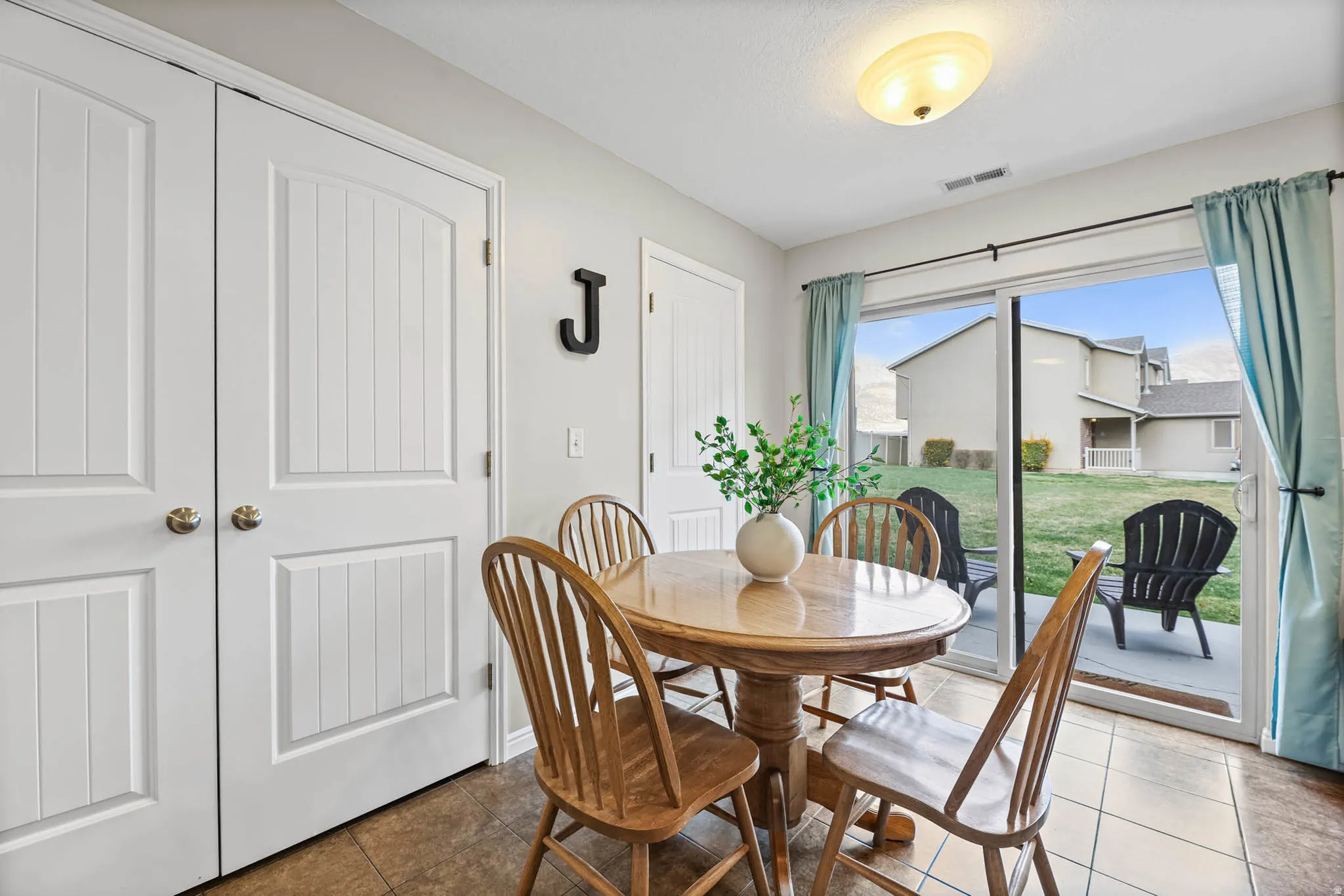 Dining space featuring tile patterned floors