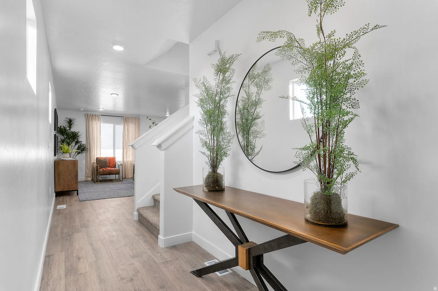 Hallway featuring light wood-style floors and recessed lighting