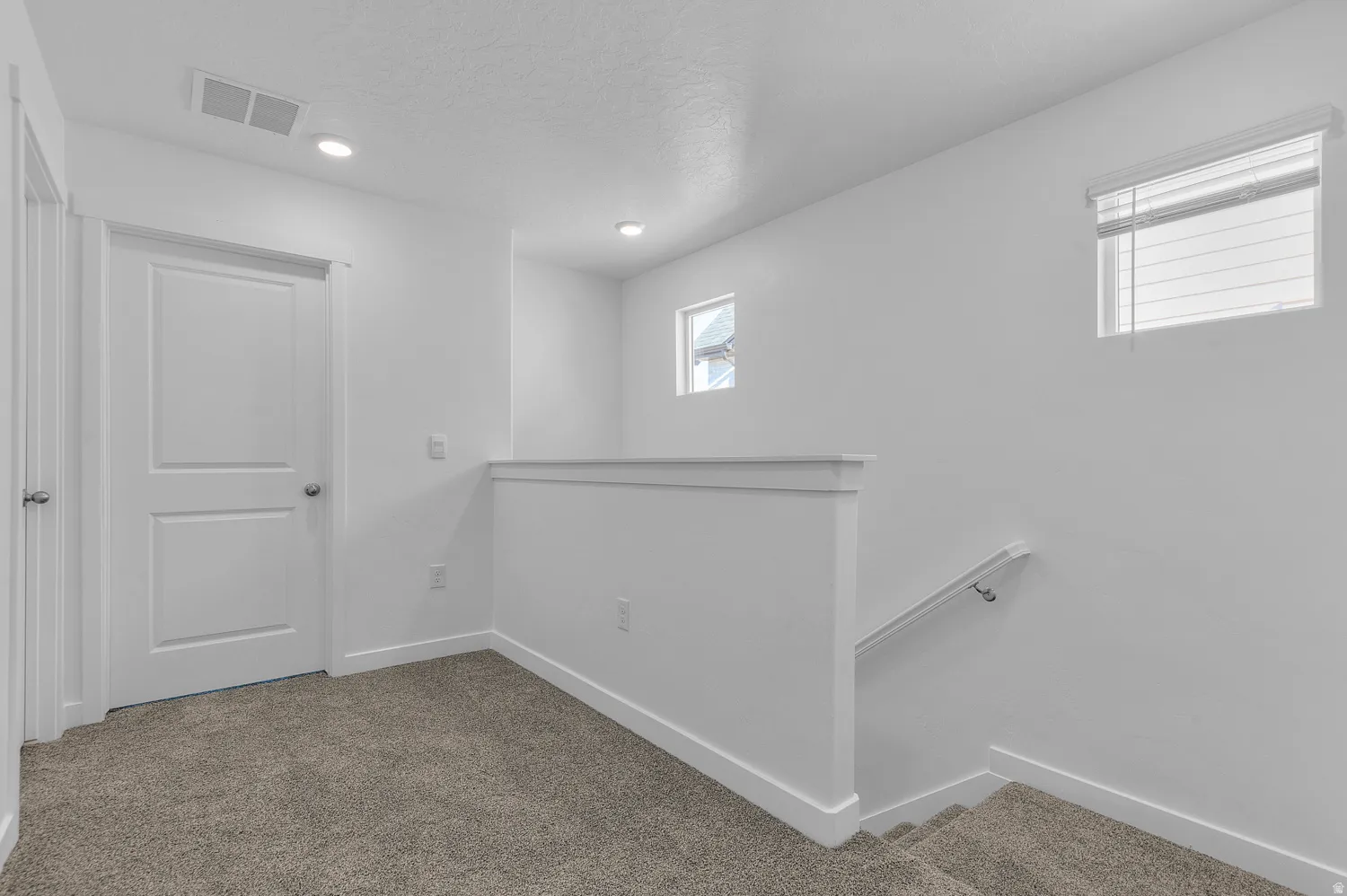Basement with carpet floors and recessed lighting