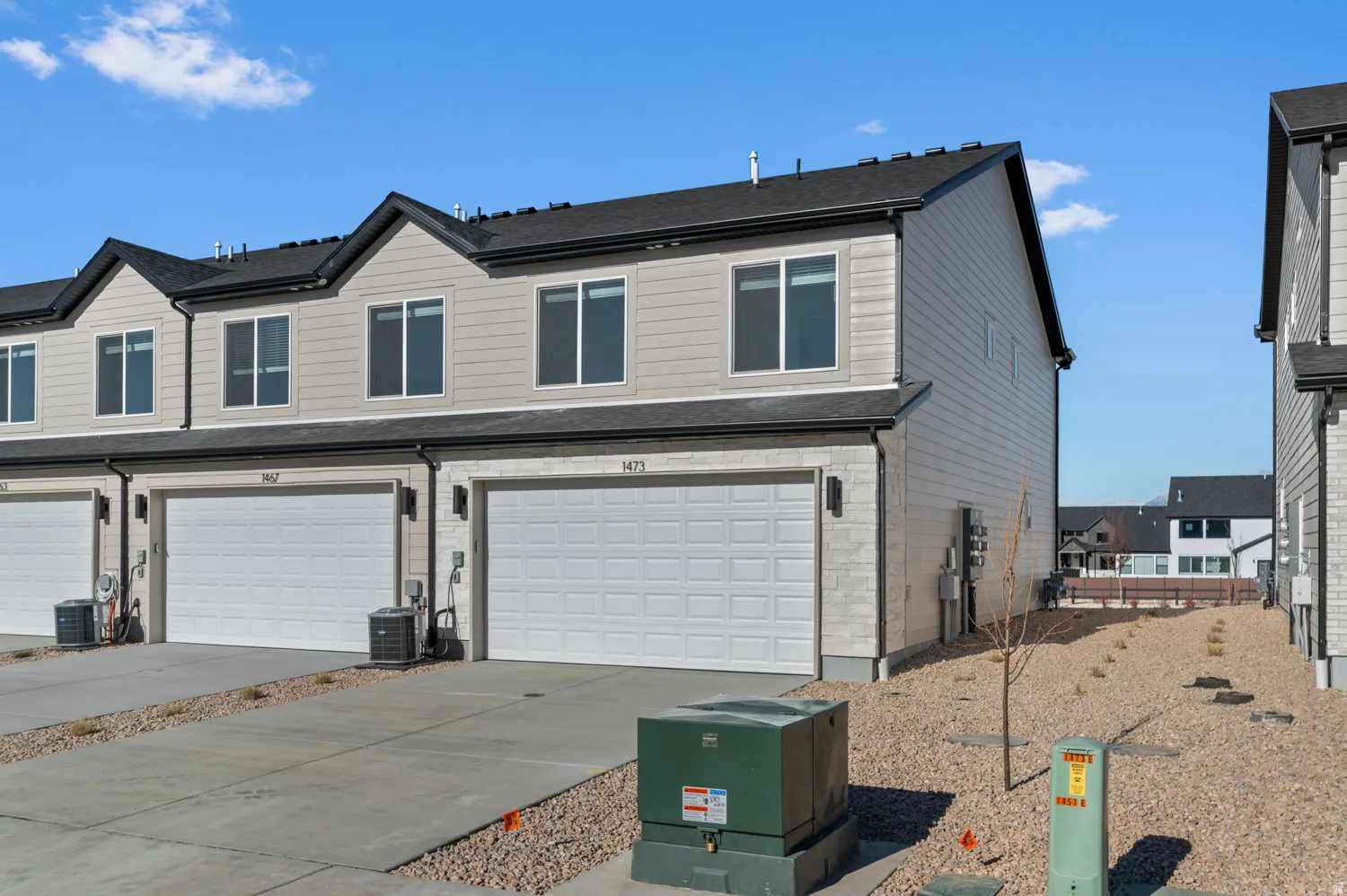 Traditional-style home with an attached garage and driveway