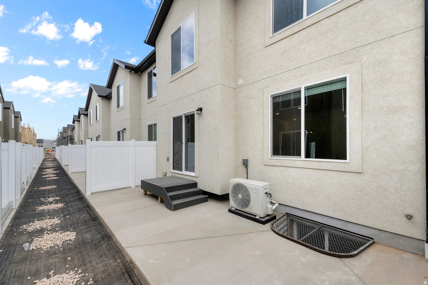 Back of house with stucco siding