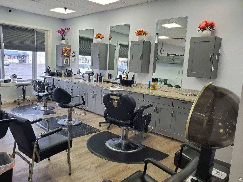 Bathroom with a drop ceiling, plenty of natural light, and vanity