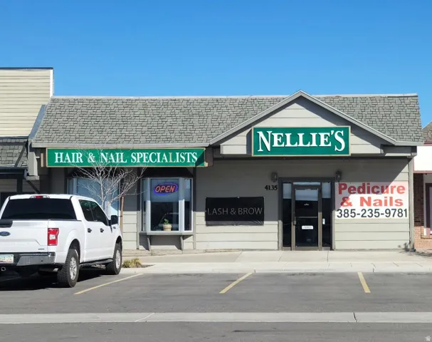 View of property featuring uncovered parking