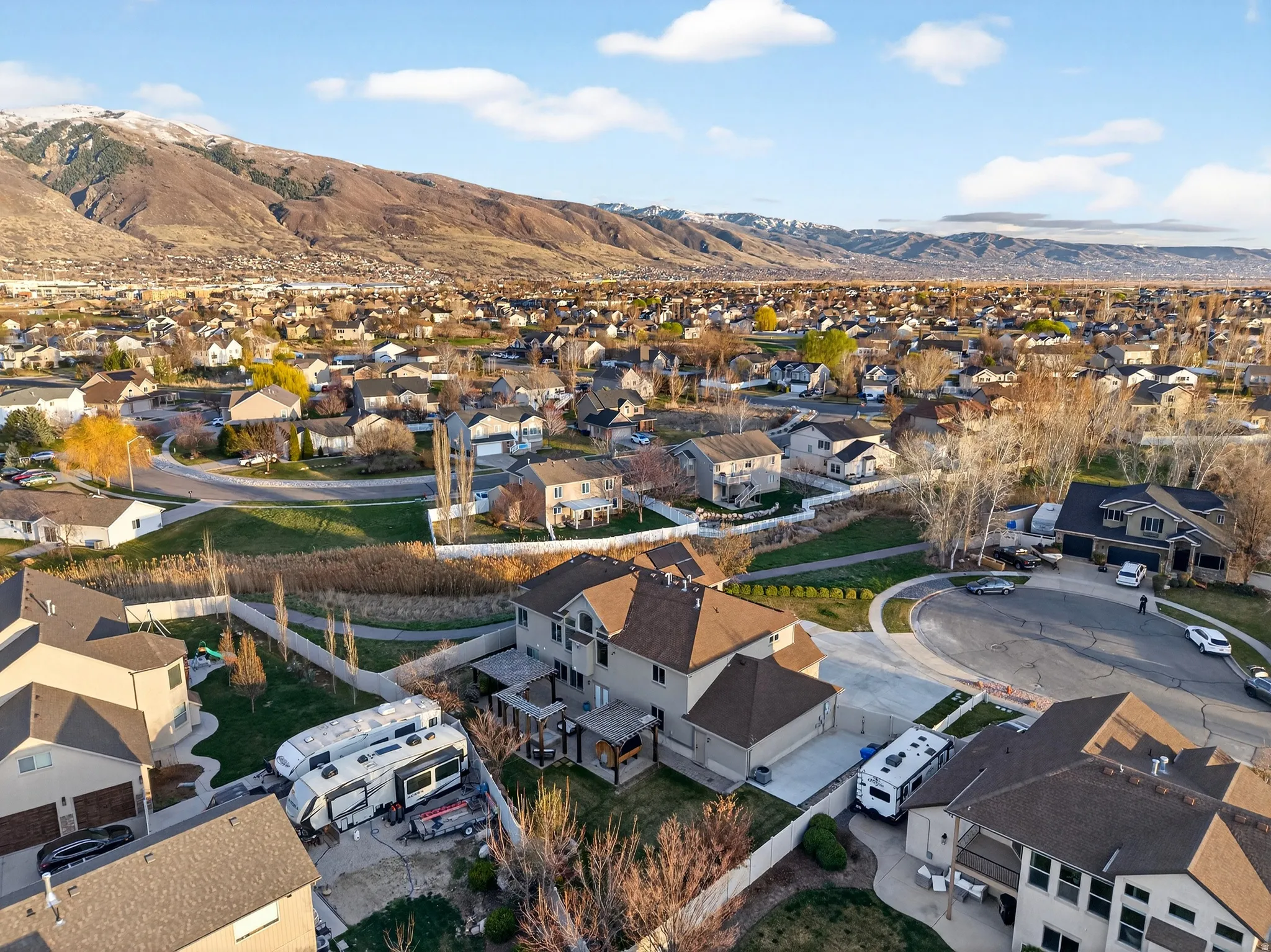 Aerial view of residential area featuring a mountainous background