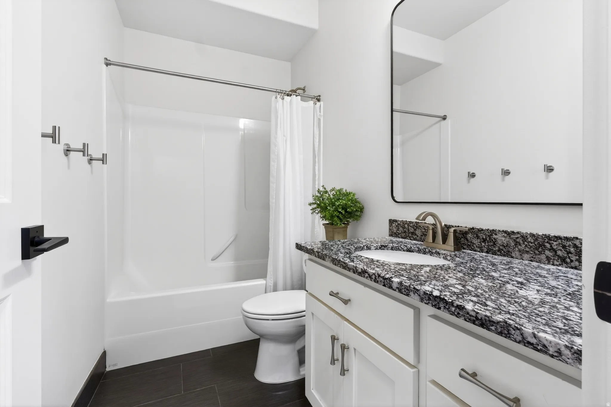 Bathroom featuring vanity and shower / bath combo