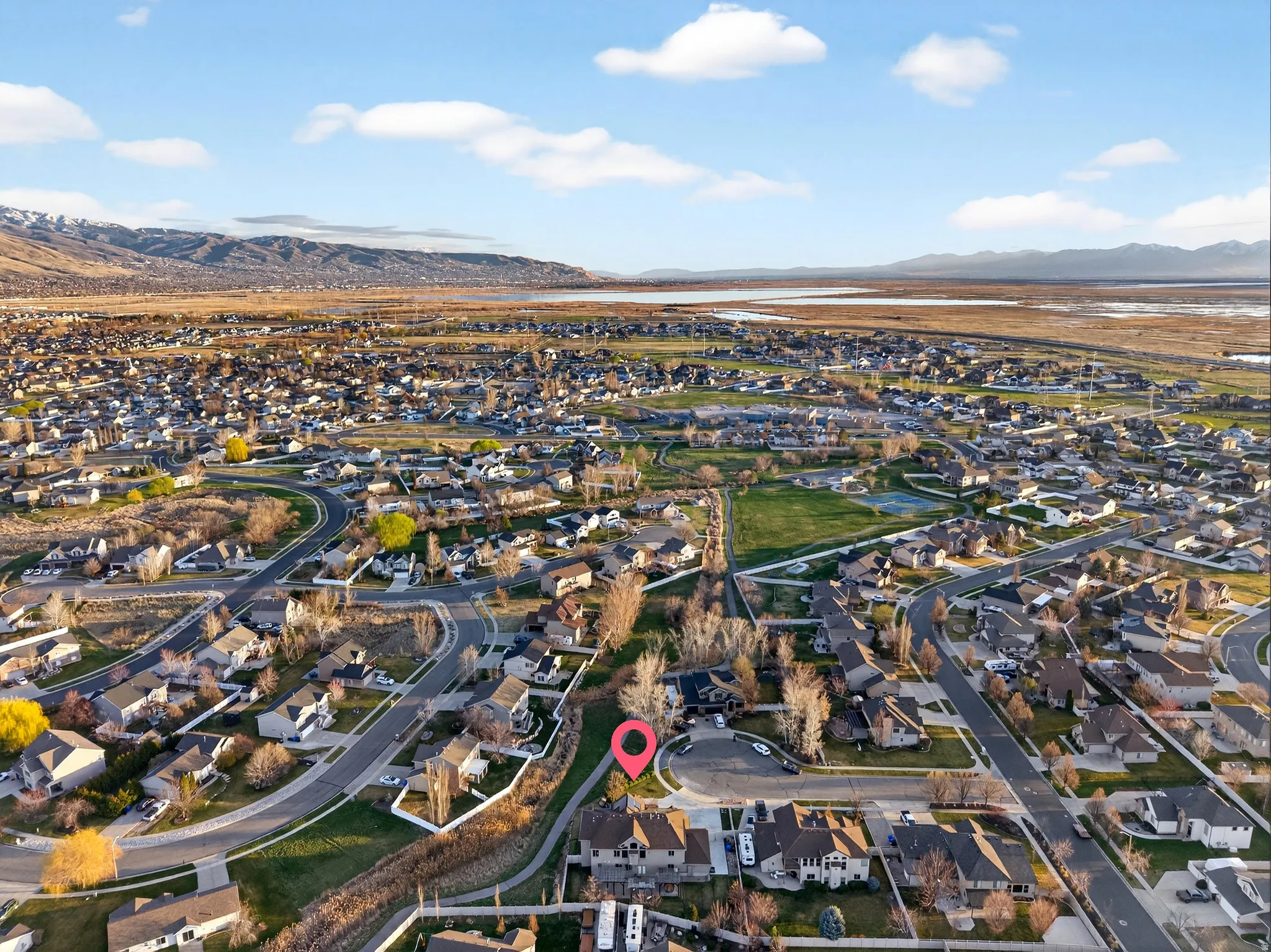 Aerial perspective of suburban area with a mountain backdrop