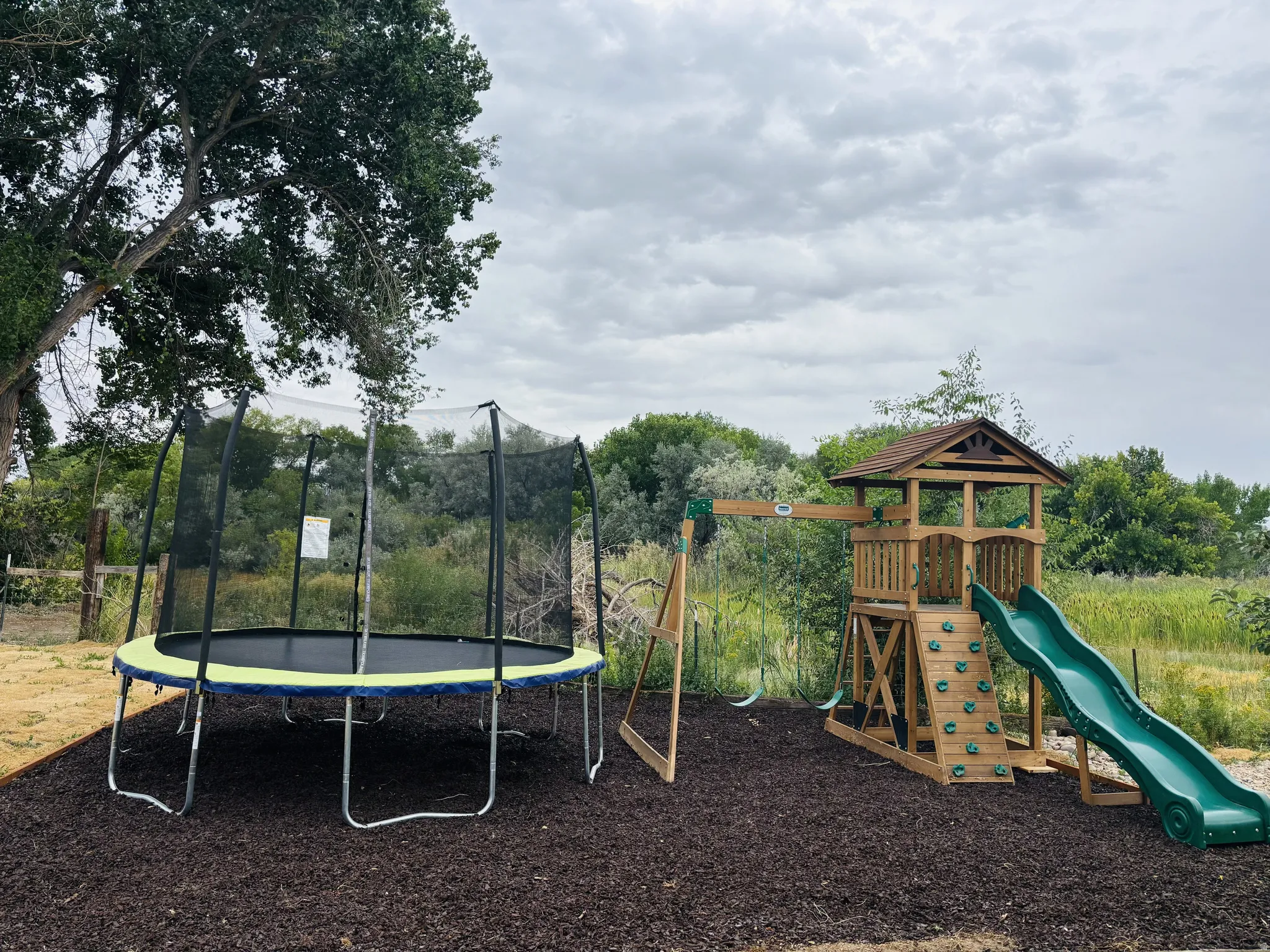 Community play area featuring a trampoline