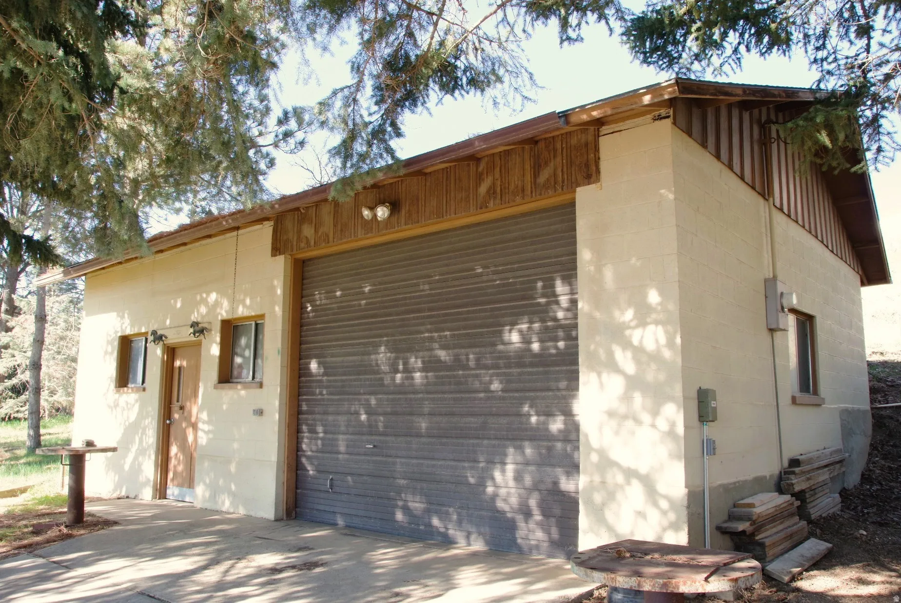 Exterior space with an outdoor structure and concrete block siding