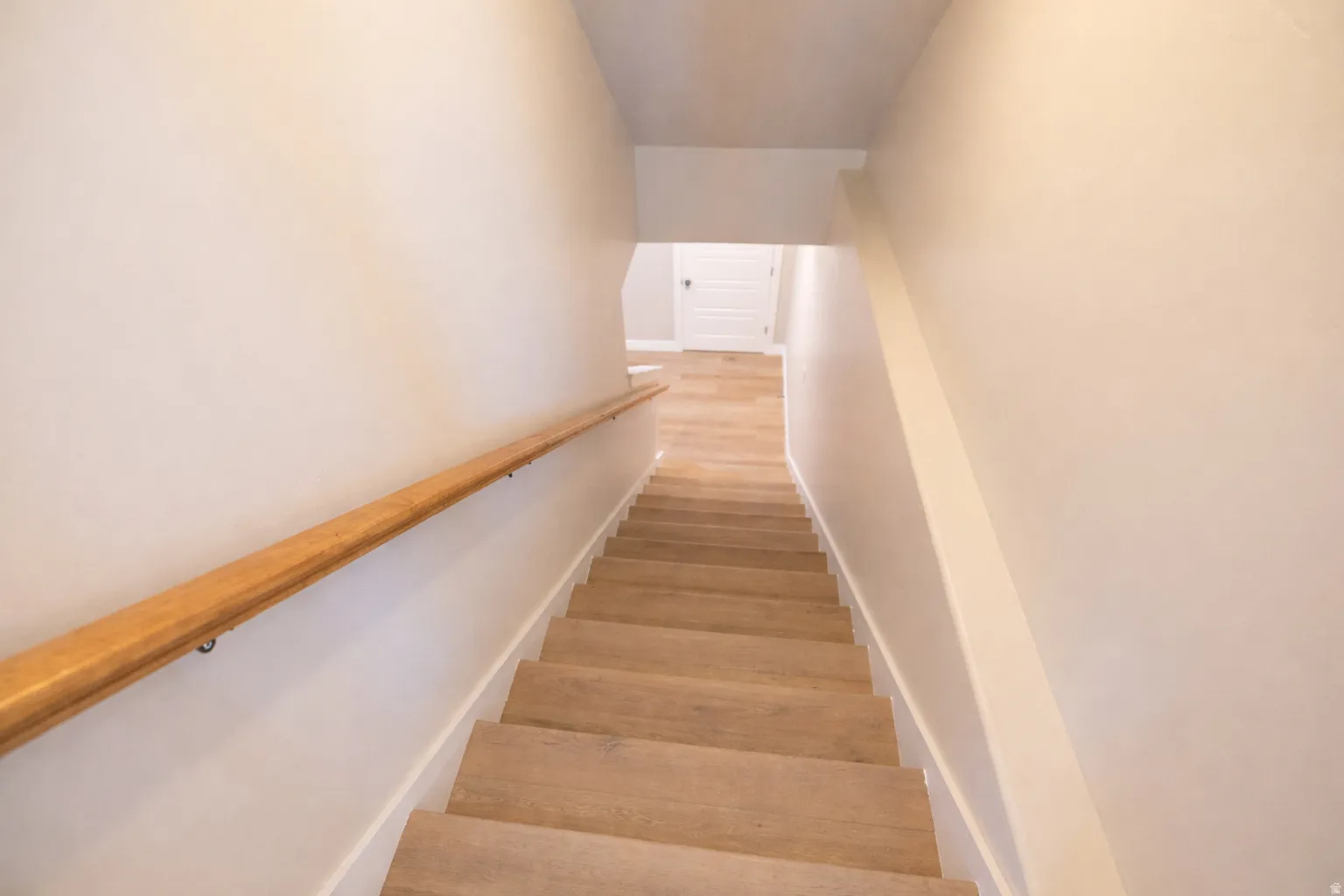 Staircase with wood finished floors
