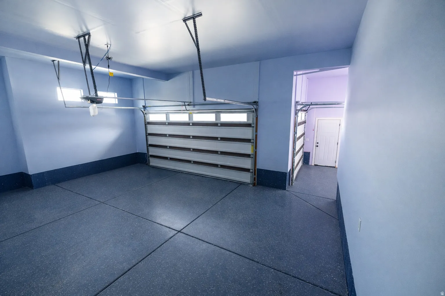 Garage featuring baseboards