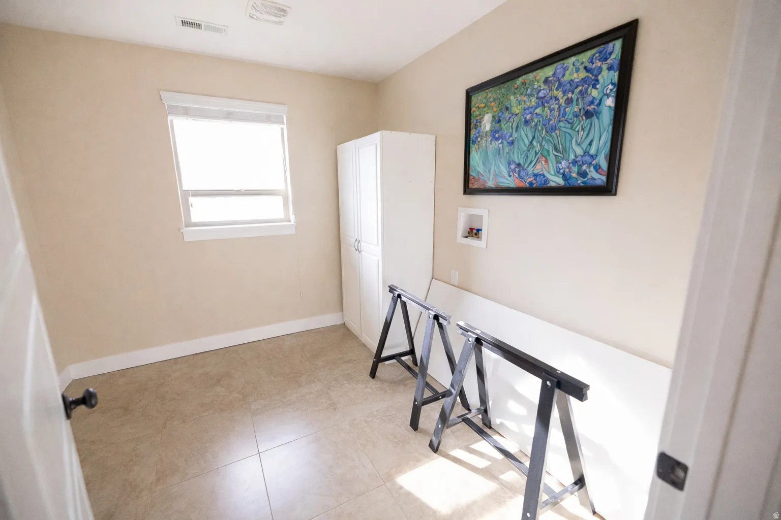 Office featuring baseboards and light tile patterned flooring