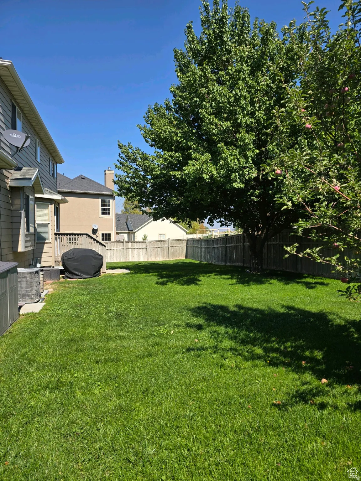 View of fenced backyard
