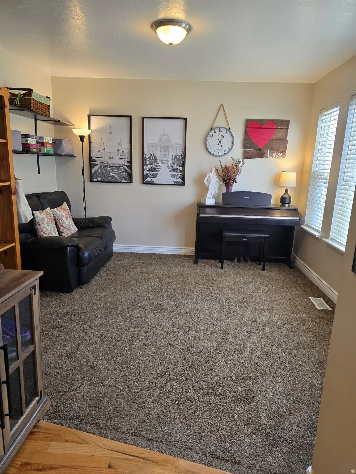 Main Floor Sitting room with baseboards and dark carpet