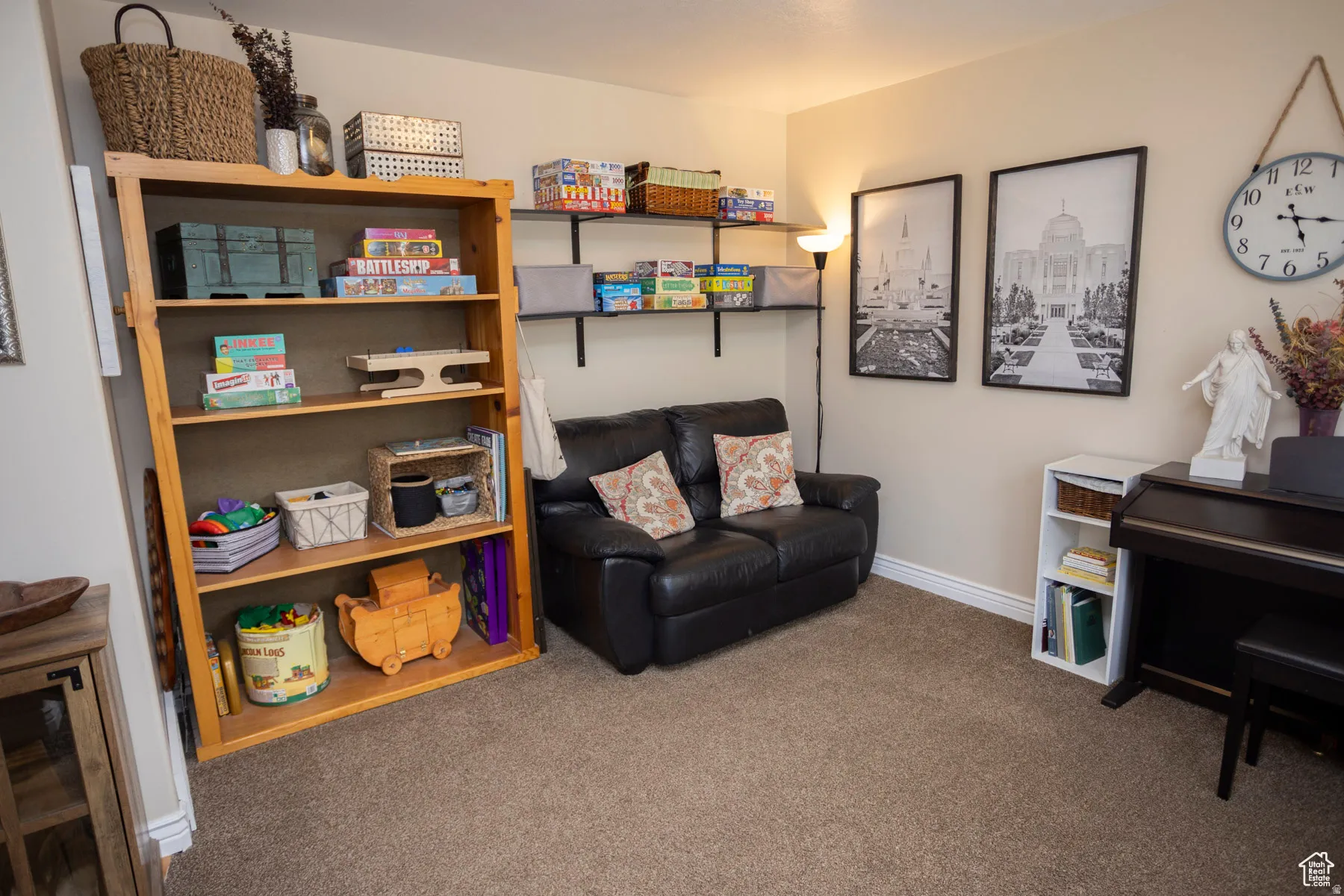 Main Floor Sitting room with baseboards and dark carpet