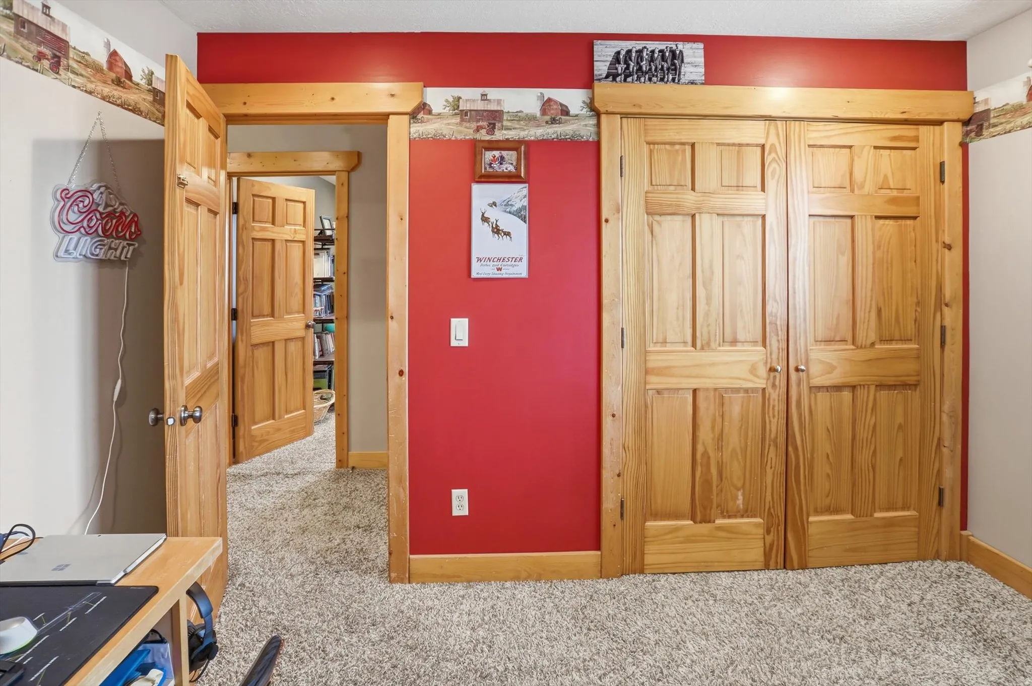 Bedroom with light carpet and a closet
