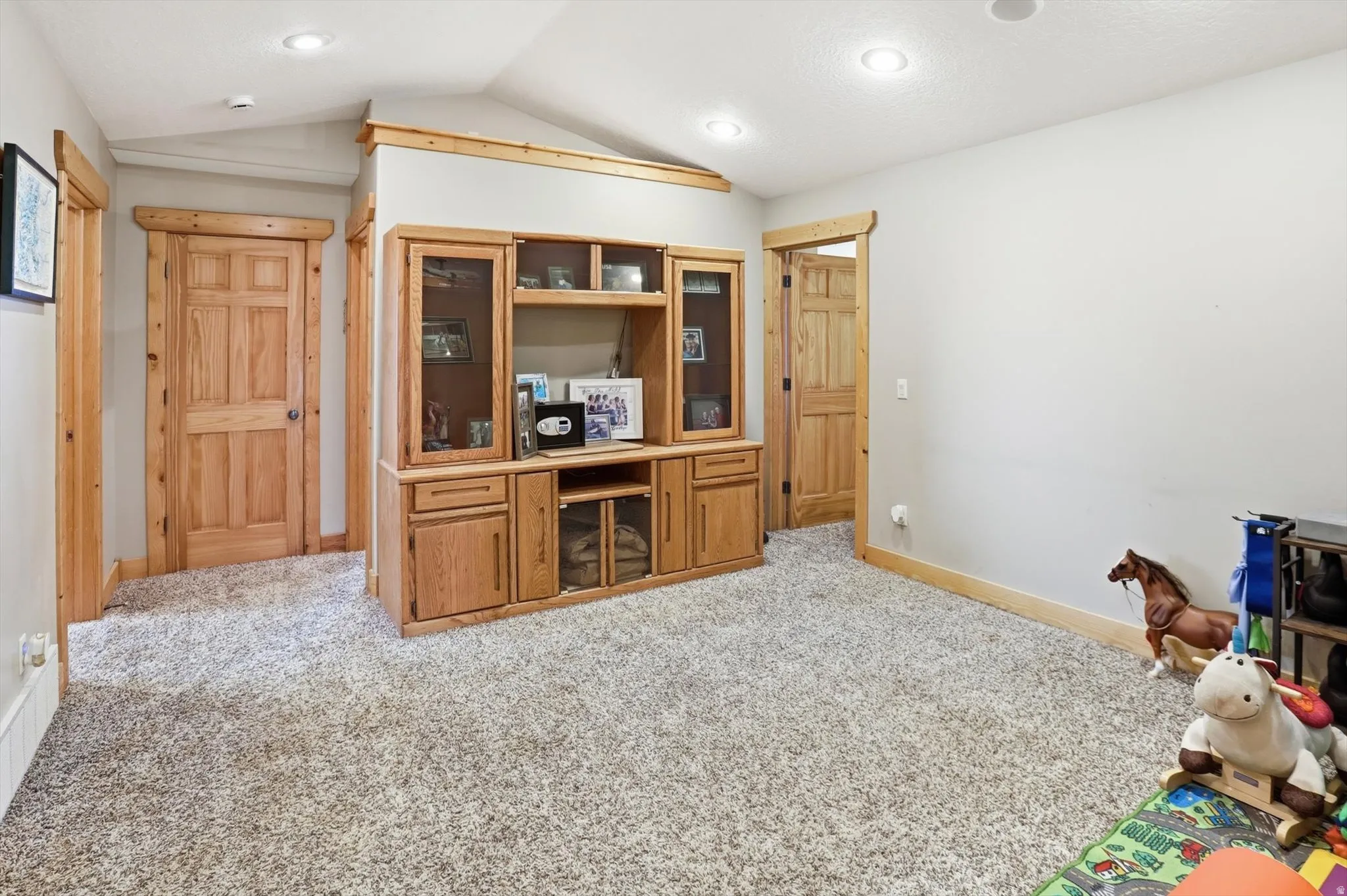 Office area featuring light carpet and baseboards