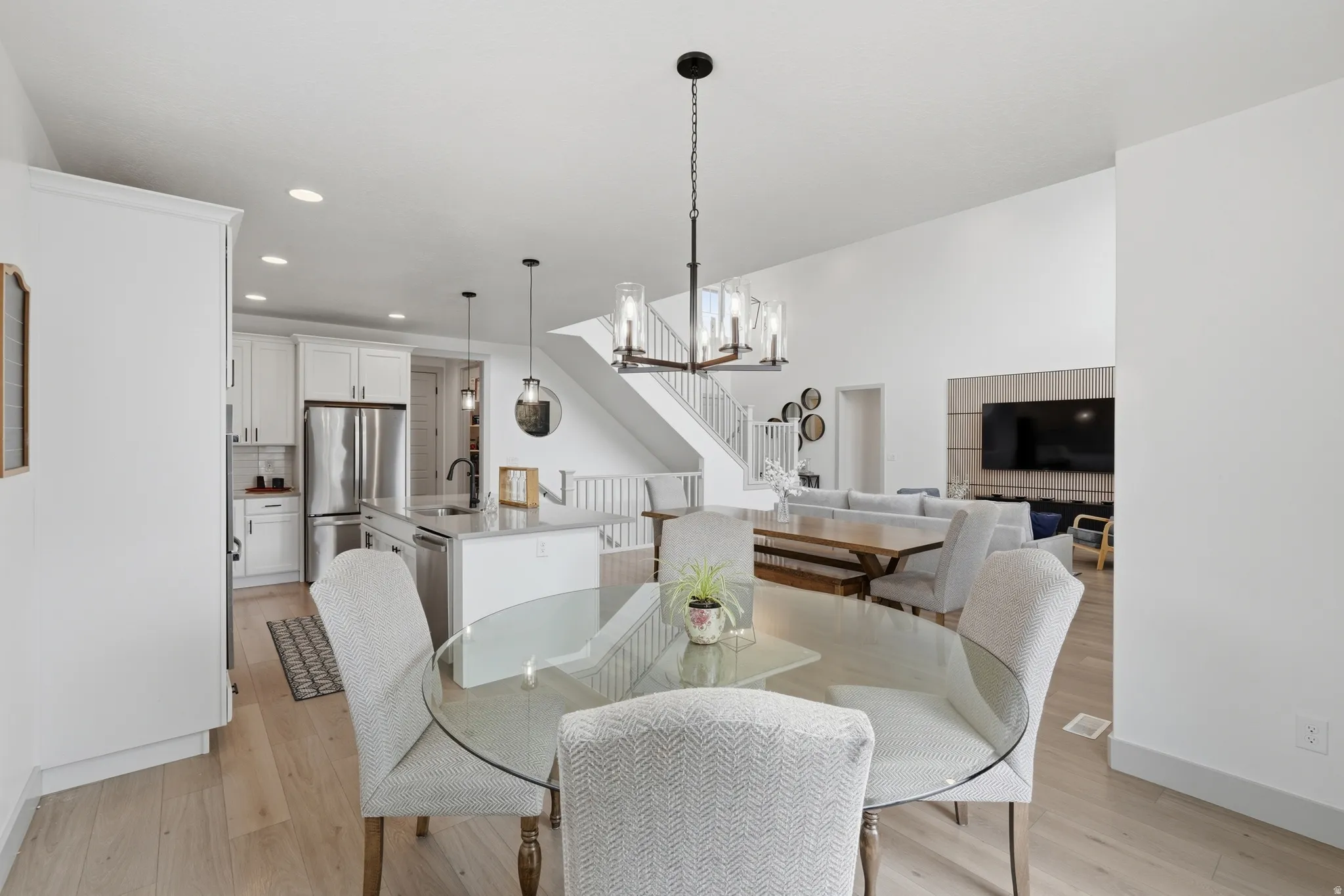 Dining space featuring light wood-type flooring and hanging lights