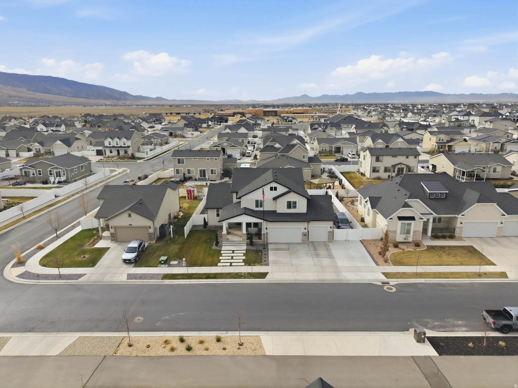 Aerial perspective of suburban area with a mountain backdrop