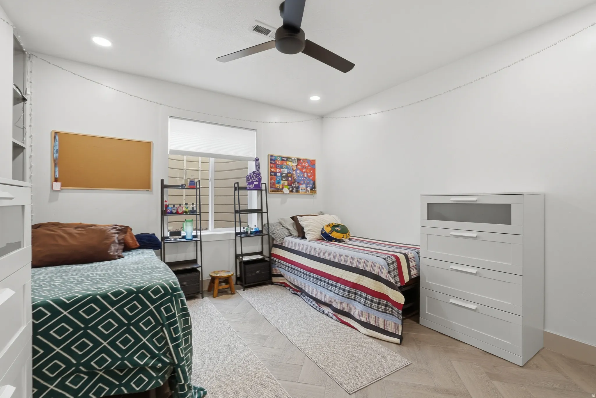 Bedroom featuring parquet flooring, ceiling fan, and recessed lighting