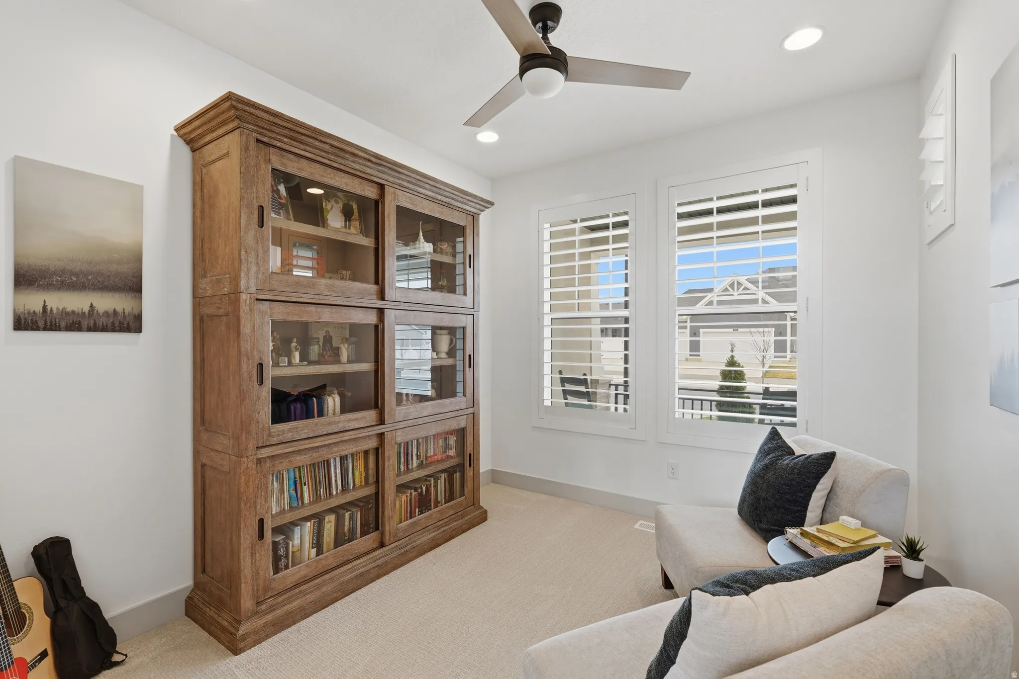Sitting room with light colored carpet, a ceiling fan, and recessed lighting