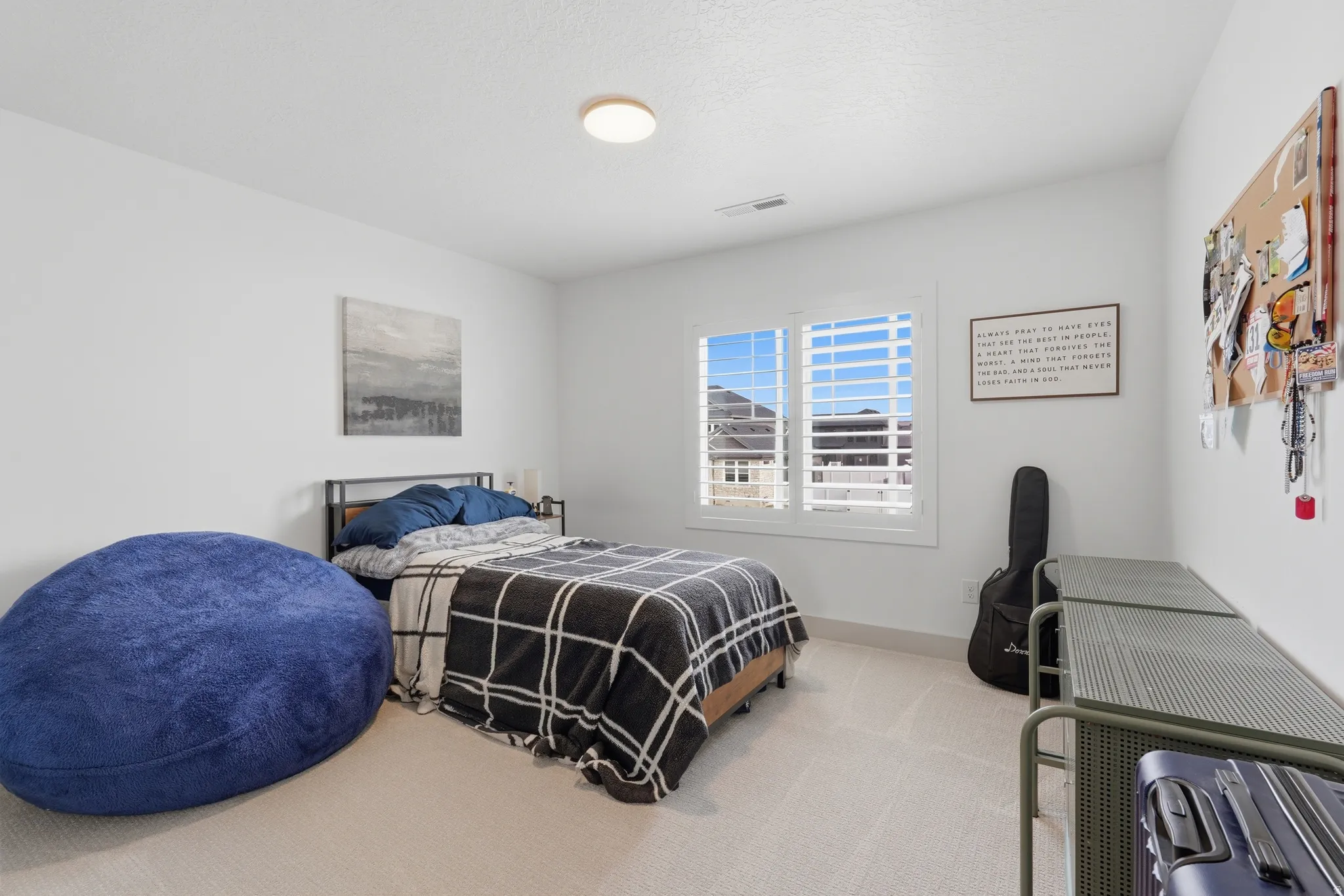 Carpeted bedroom with baseboards