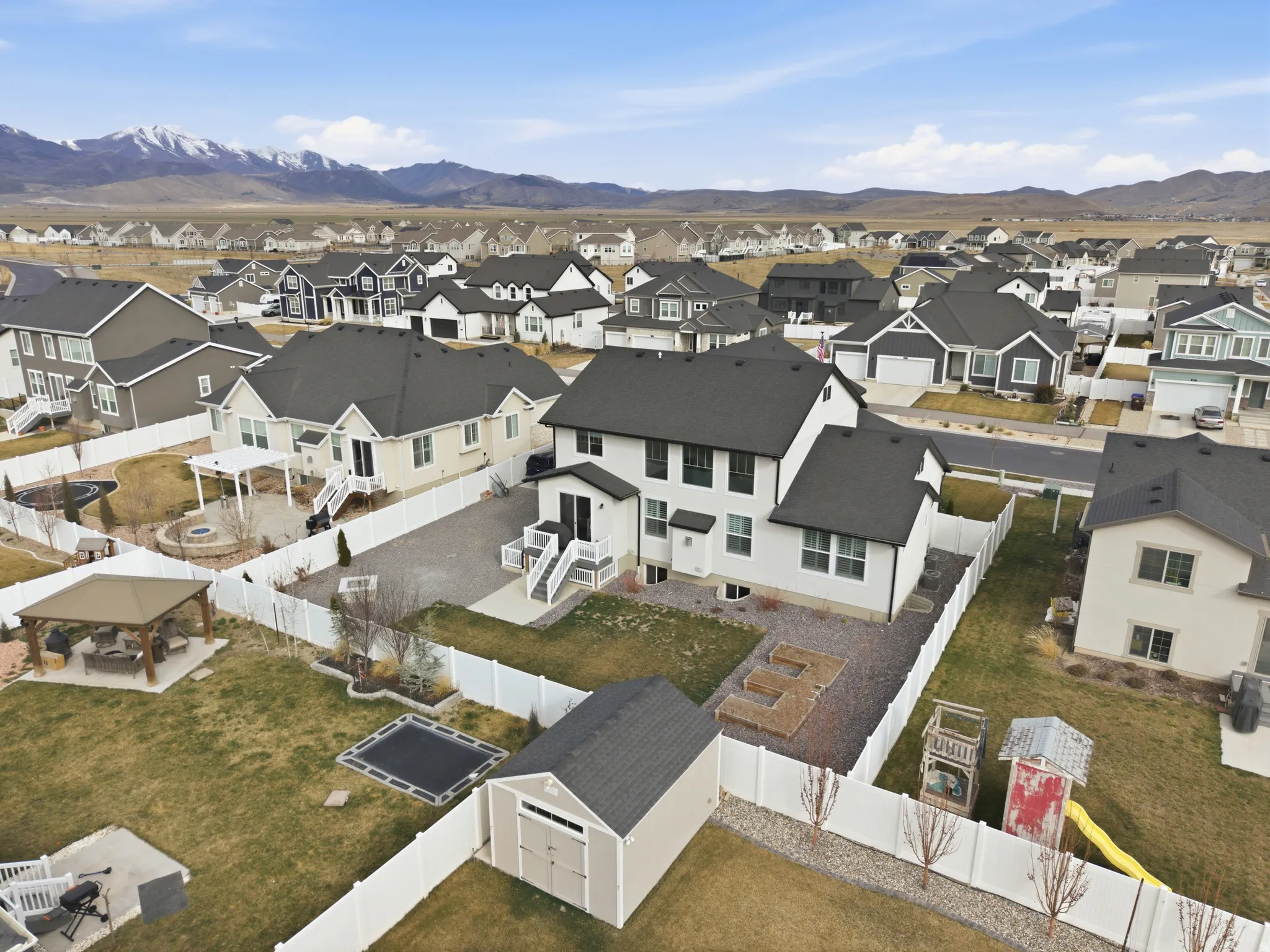 Aerial view of residential area with a mountainous background