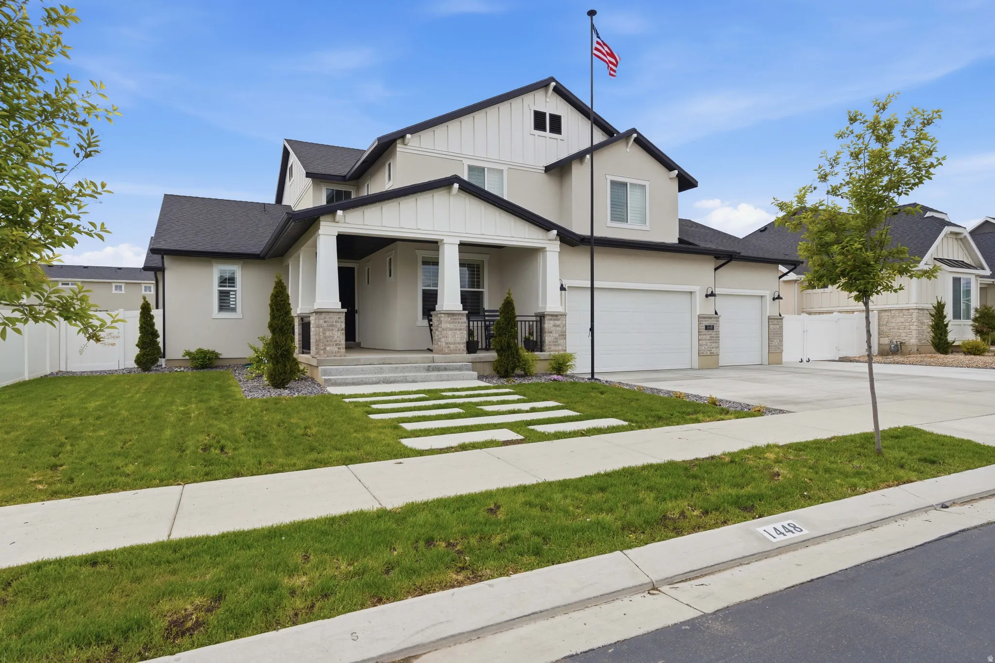 Craftsman house featuring a porch, concrete driveway, stucco siding, roof with shingles, and stone siding