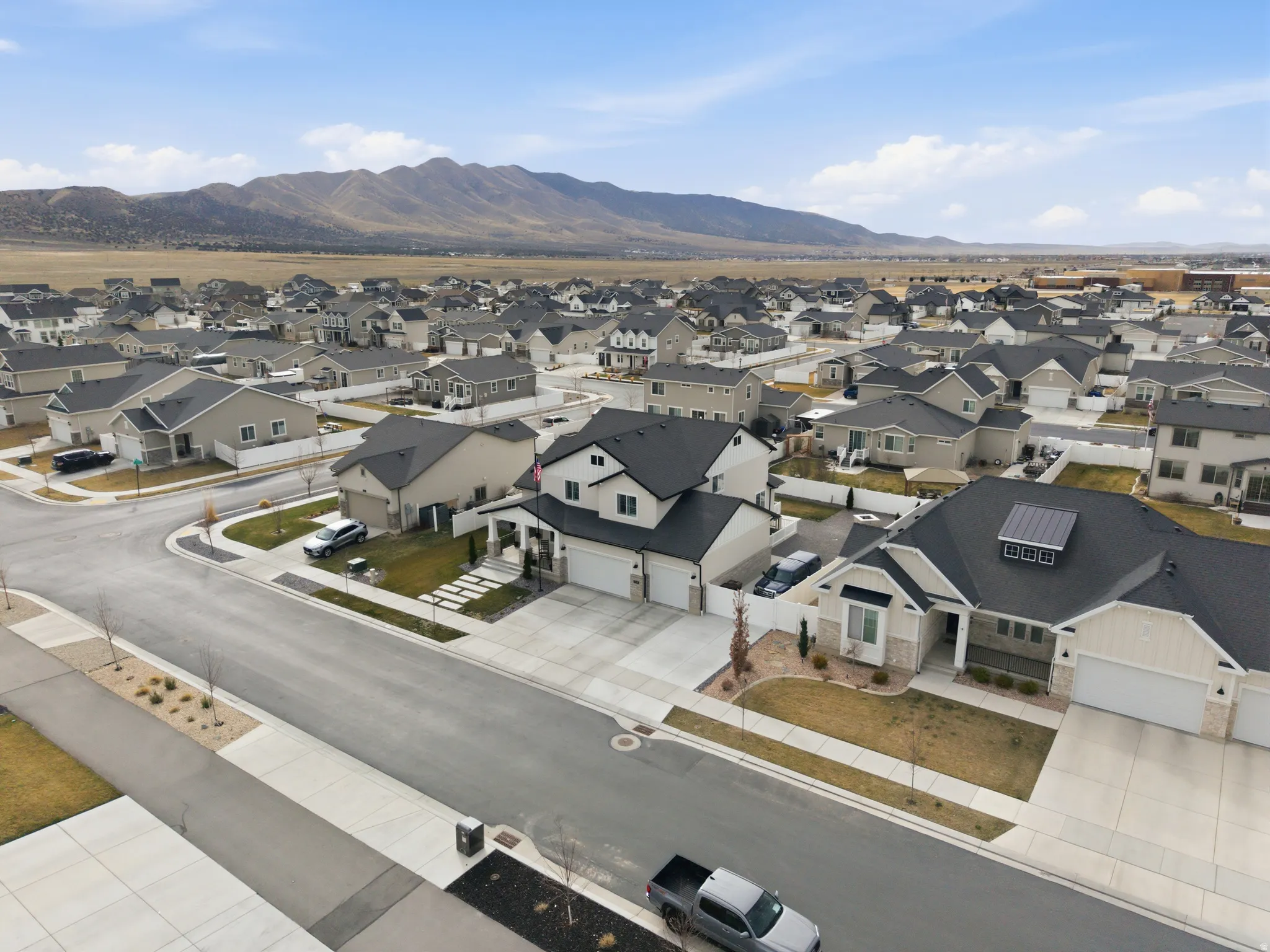 Aerial view of residential area featuring mountains