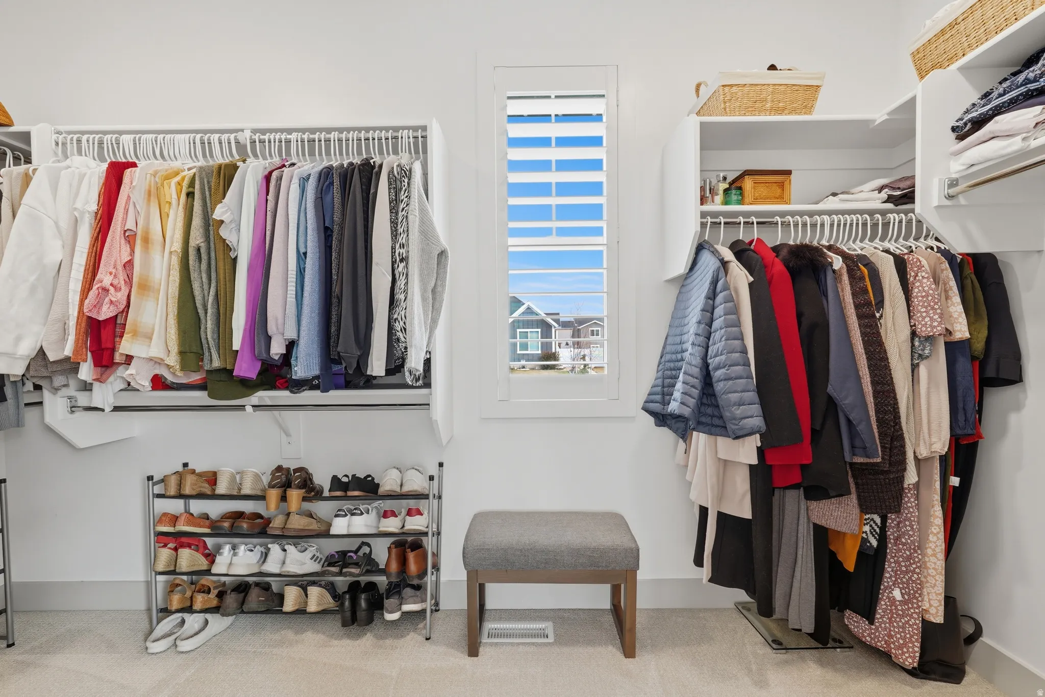 Walk in closet featuring carpet floors