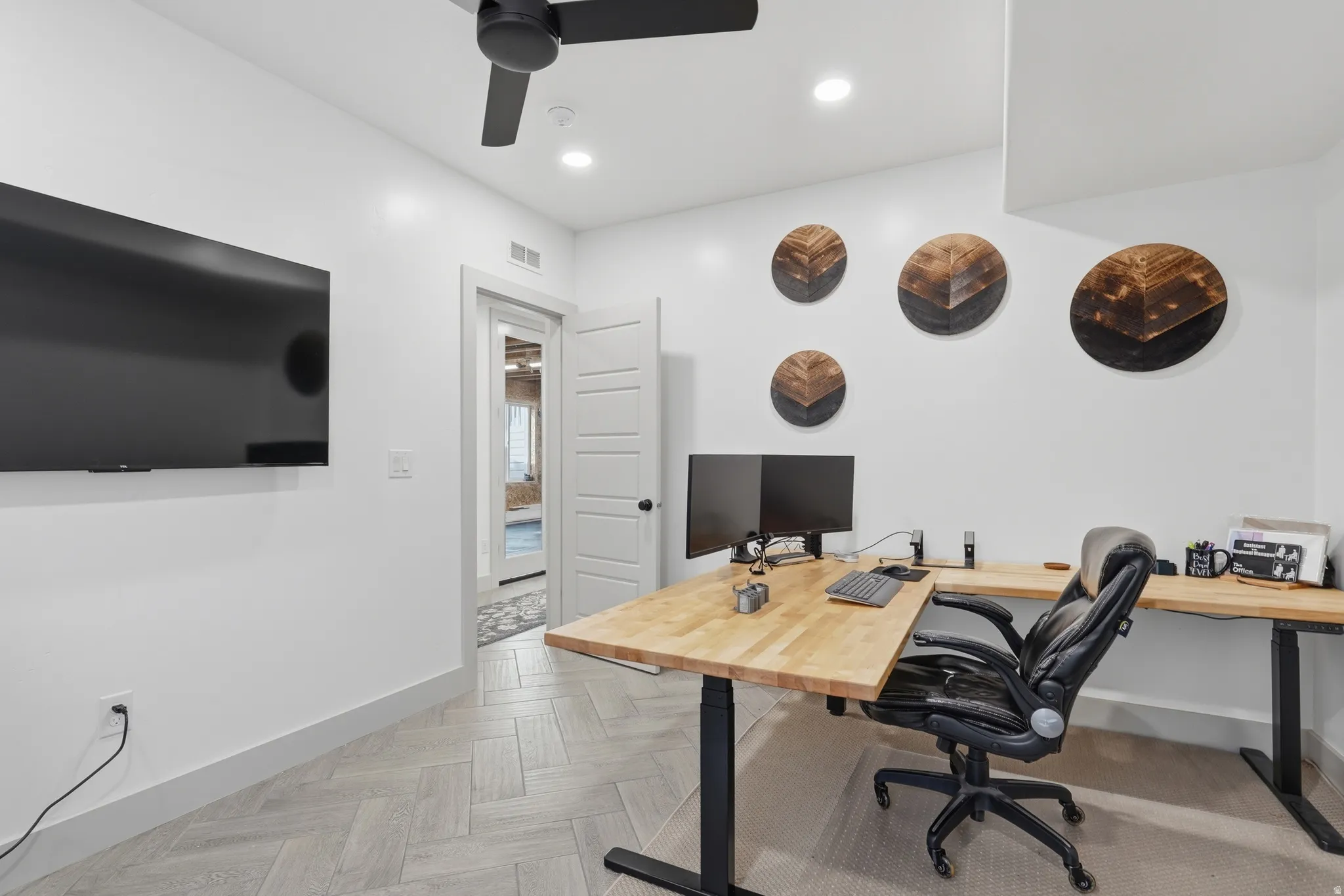 Office space featuring parquet floors, ceiling fan, and recessed lighting