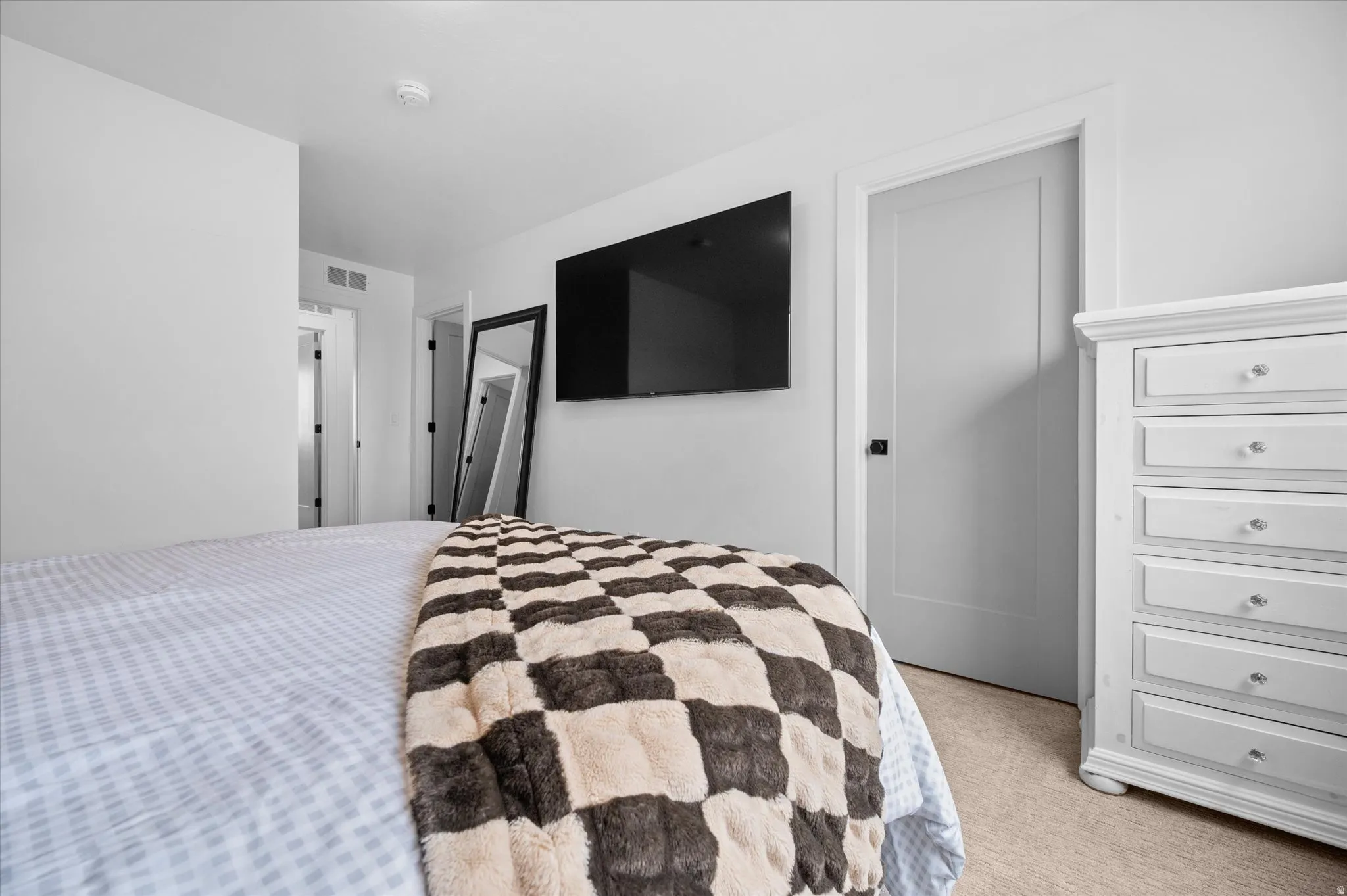 Owner's Suite with walk-in closet and attached 3/4 bathroom.